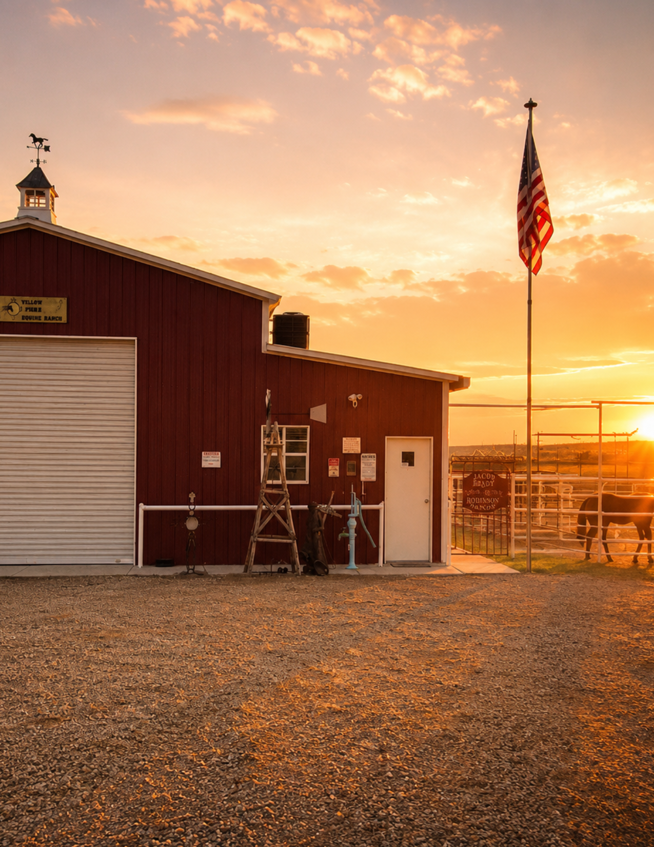 Ranch barn beneath a glowing sunset at the Reset in the Desert yoga retreat in Carlsbad, New Mexico.