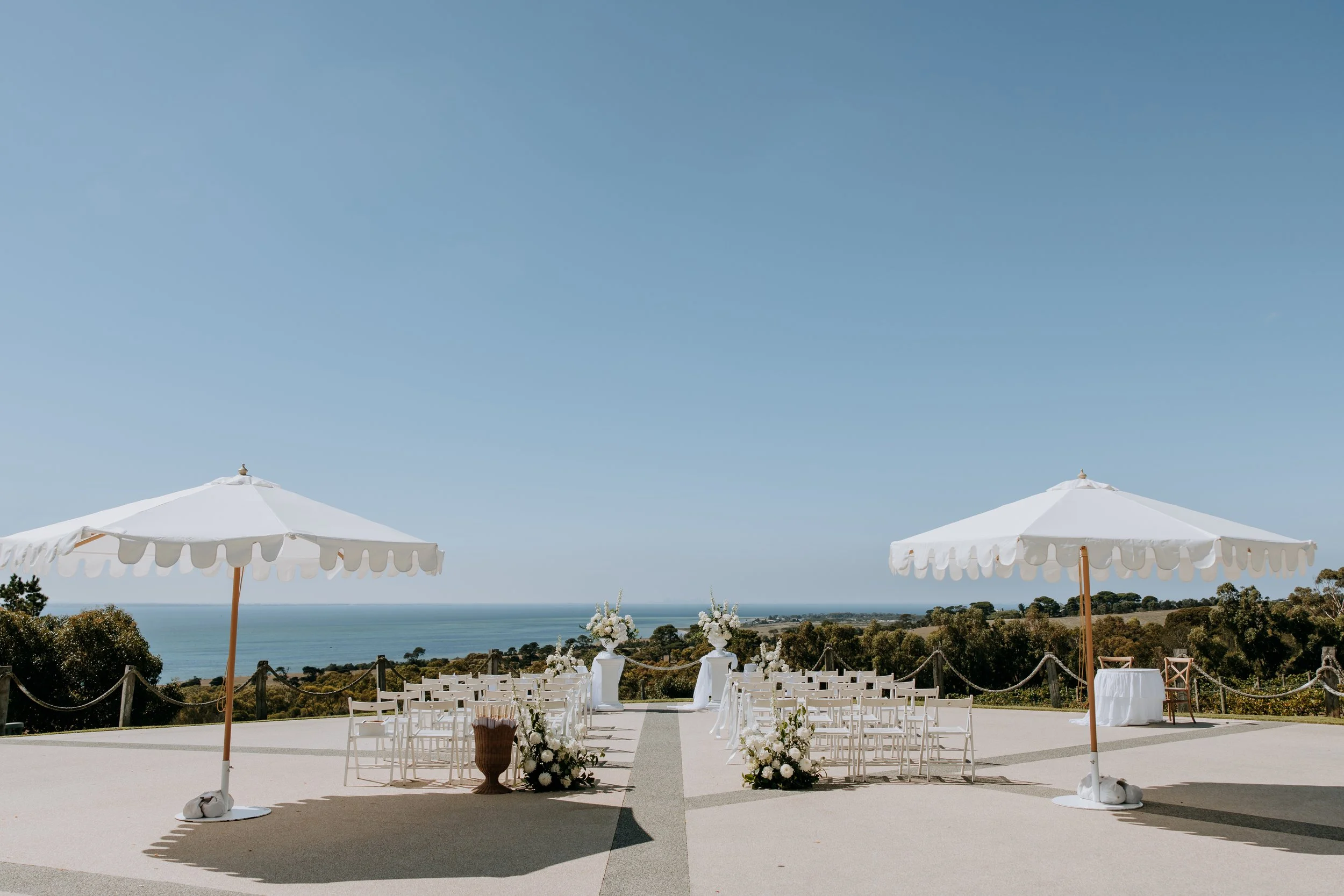 Beautiful winery wedding over looking the seaside managed and planned by Bloom & Veil Events Co 