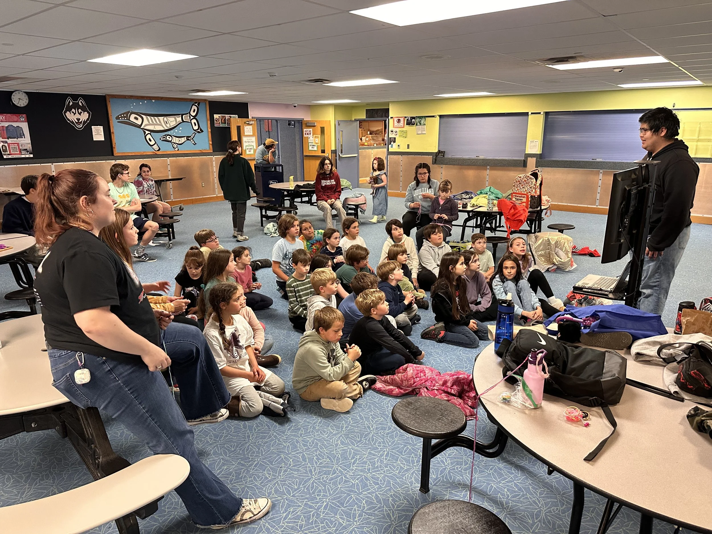 Photo of youth sitting and learning, courtesy of the Sitka Recreation Foundation