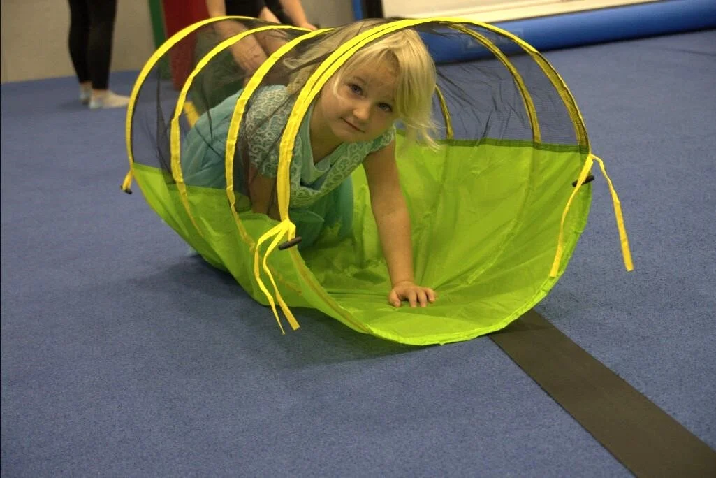A child playing in a gymnasium in Sitka.