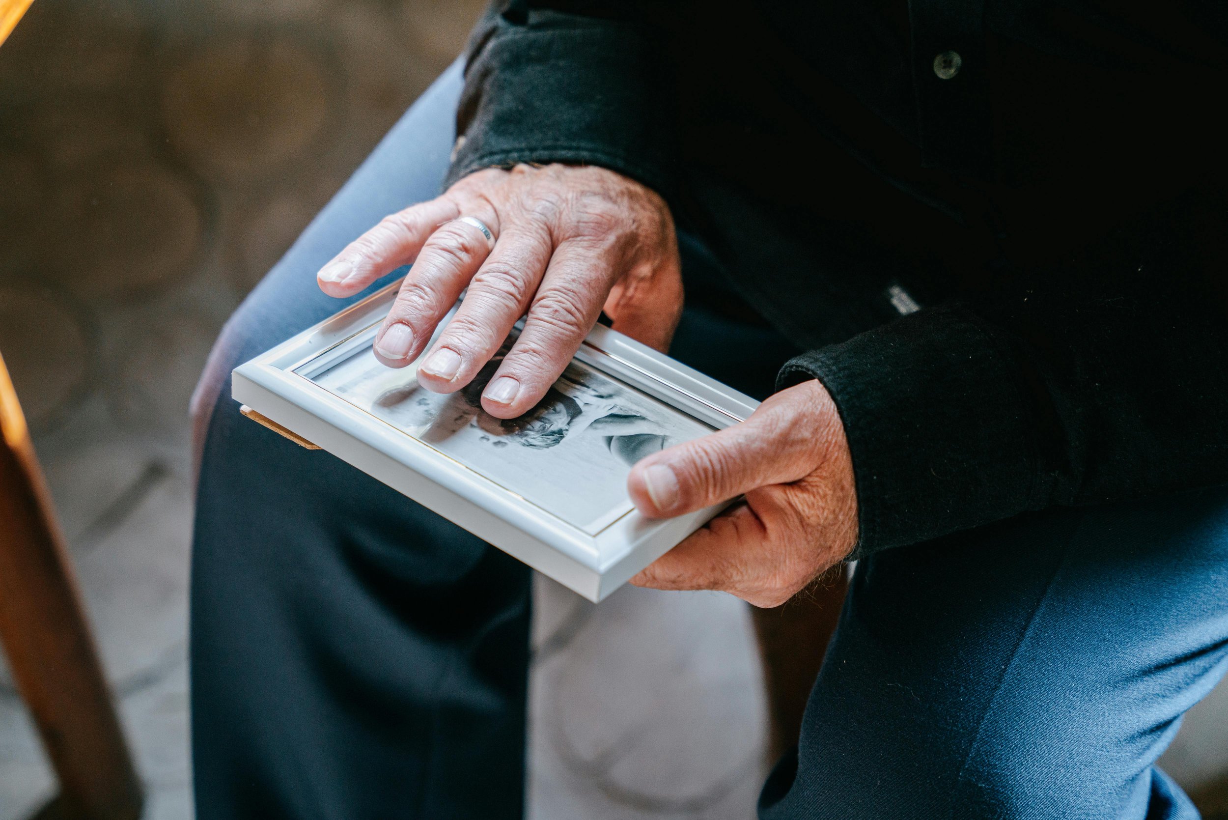 a man looking at an old photograph
