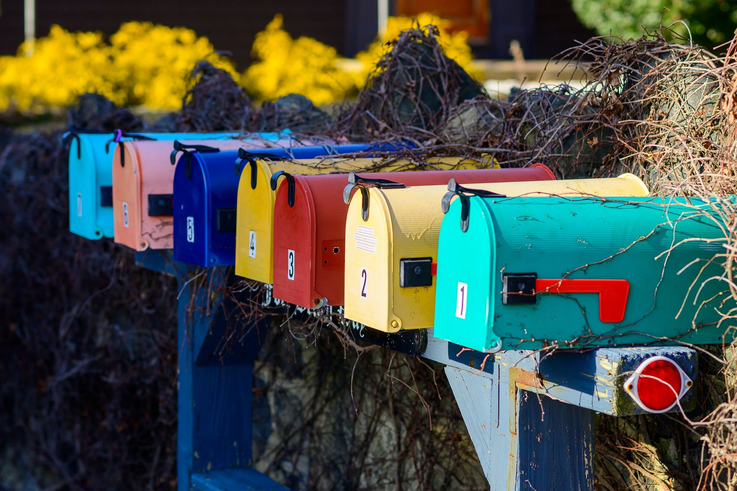 Colorful mailboxes representing direct mail, bulk mailing, and mailing services