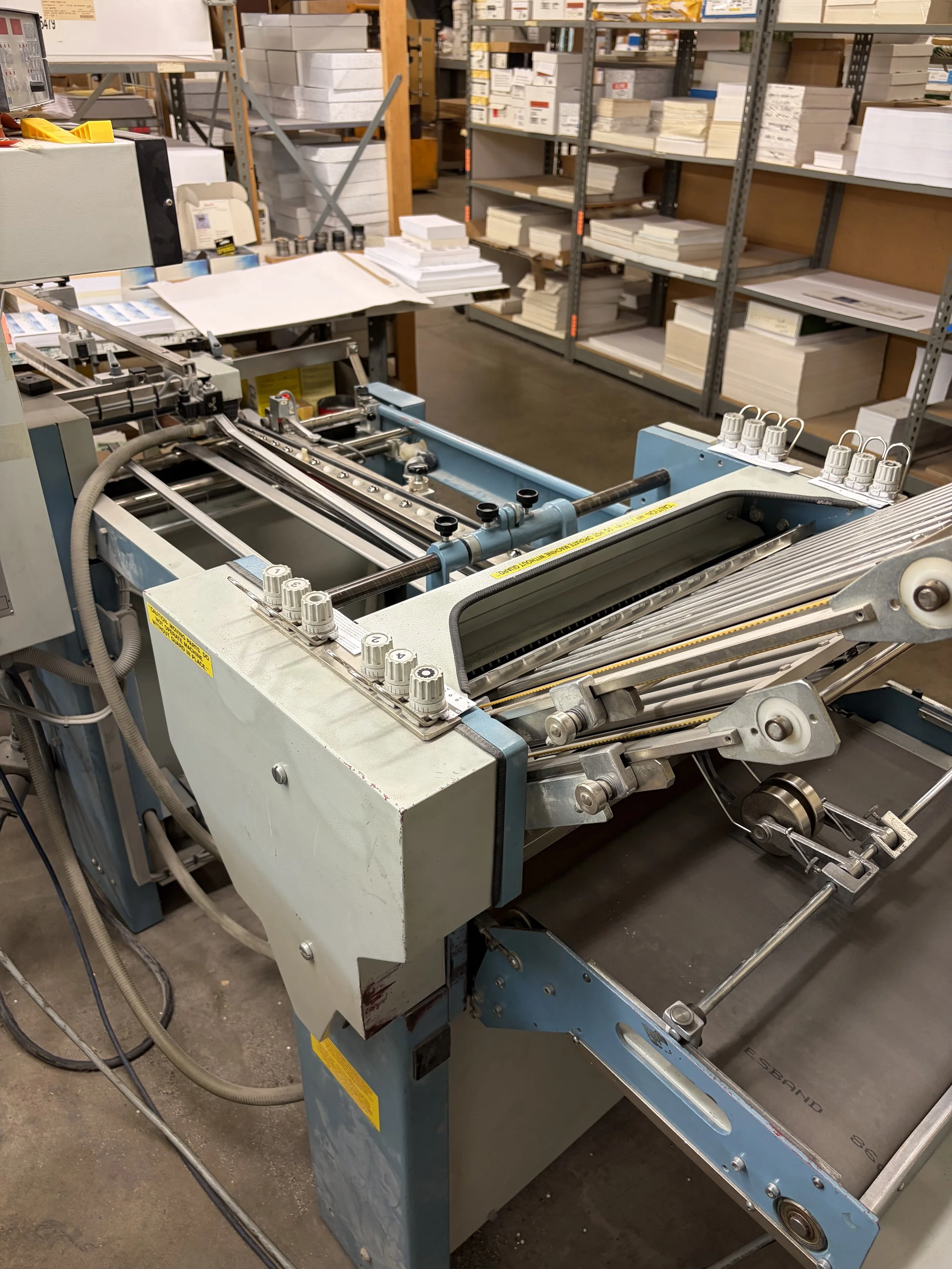 Commercial bindery and finishing equipment used for high-volume print production