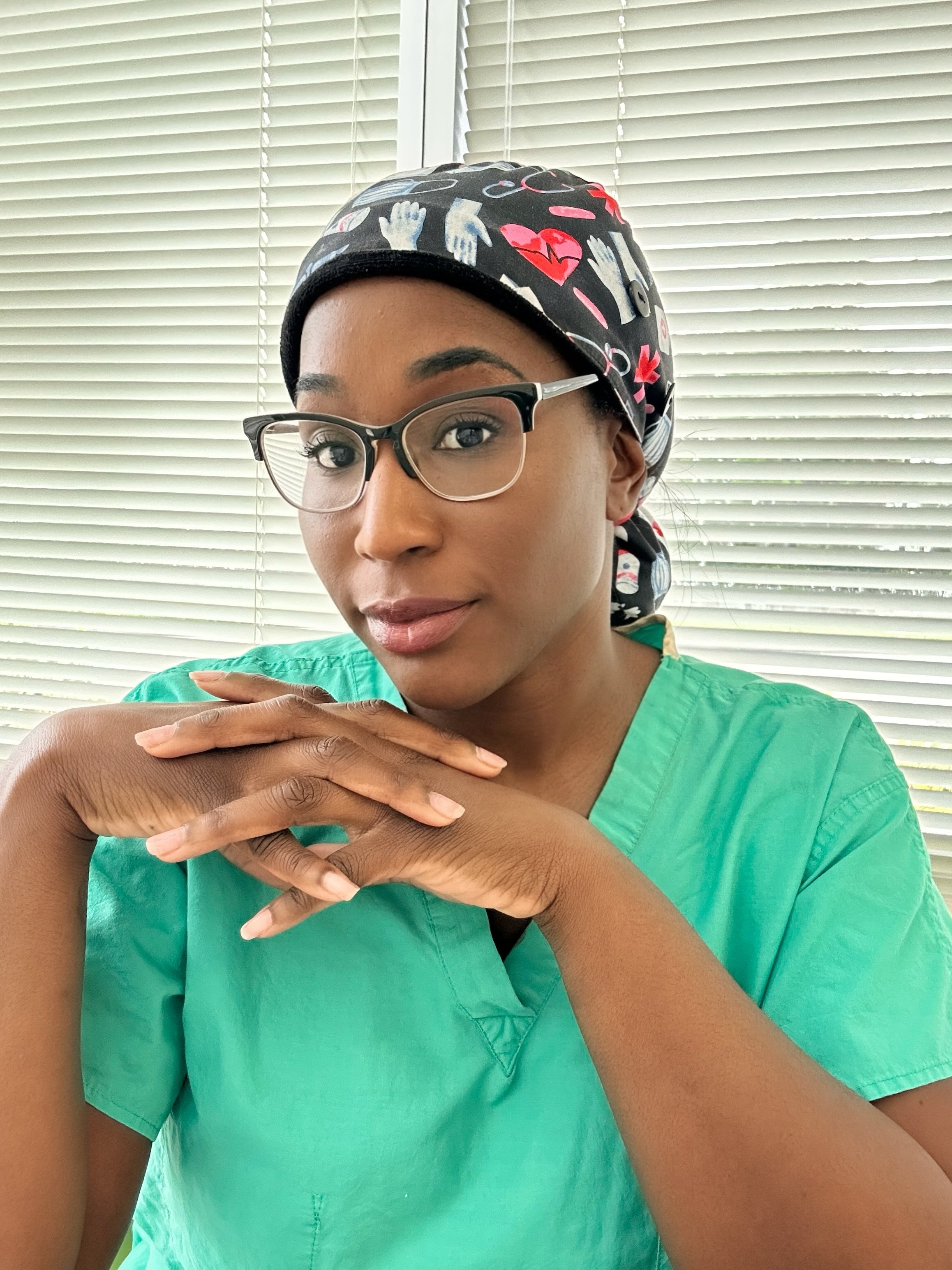 Shevaughn Shay, SRNA and founder of Anesthesia Aesthetics, in scrubs — CRNA school mentor and consultant for ICU nurses