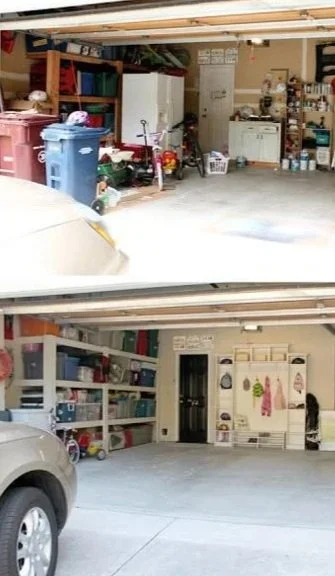 Garage with storage shelves, tools, and various items, with a vehicle partially visible in the foreground.