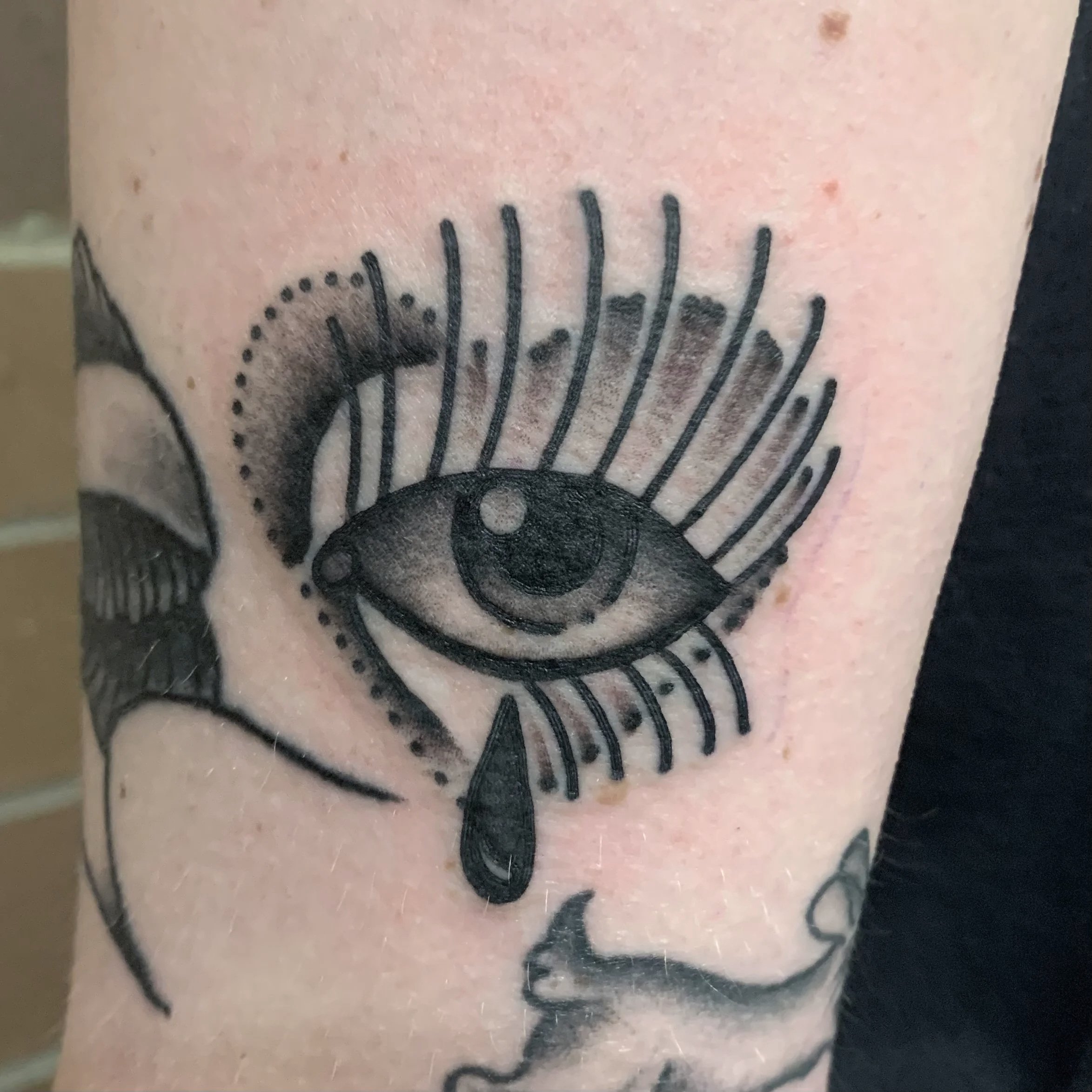 Black and Grey Cholita Eyeball Tattoo