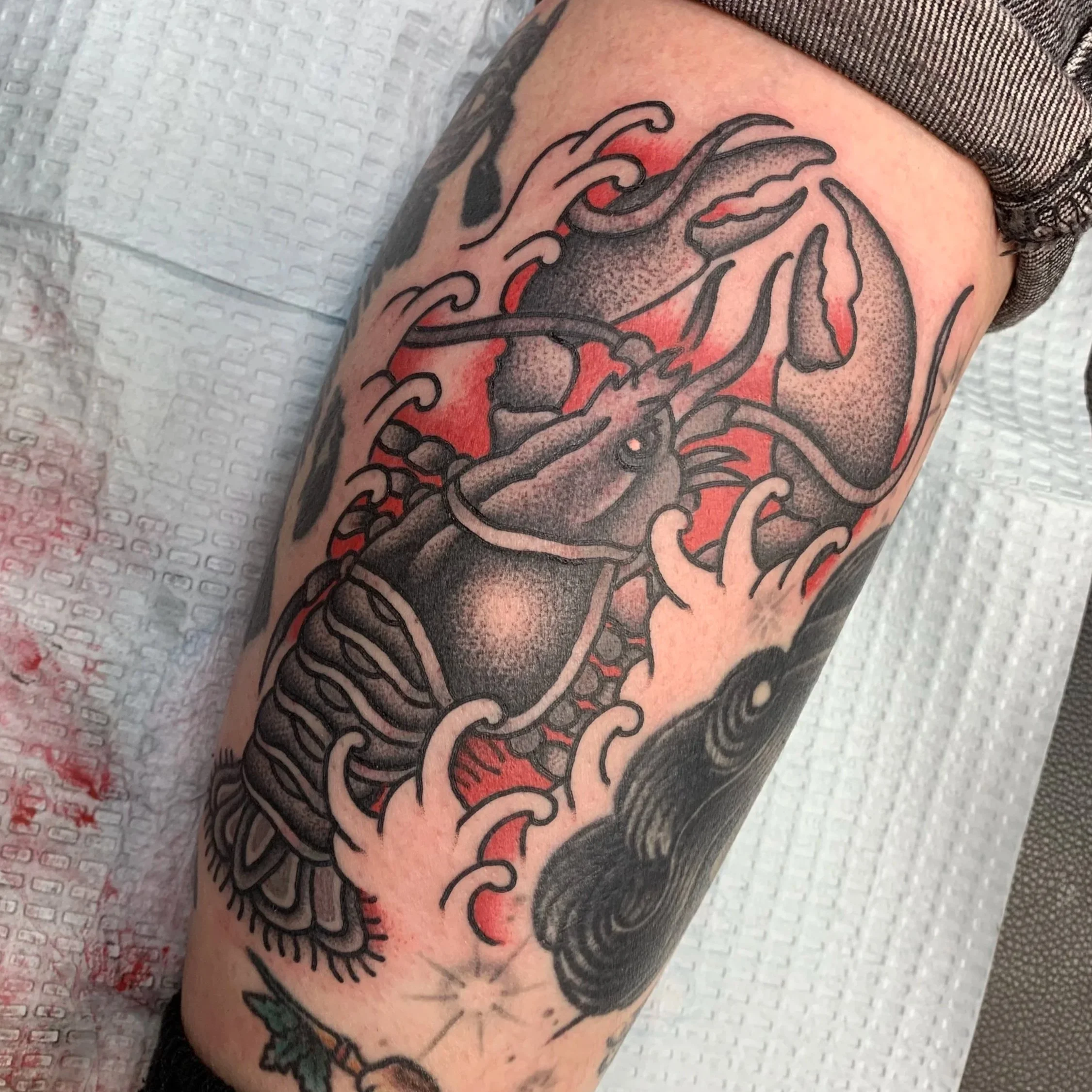 Traditional Japanese Lobster tattoo done in Blackwork/Dotwork with a splash of red