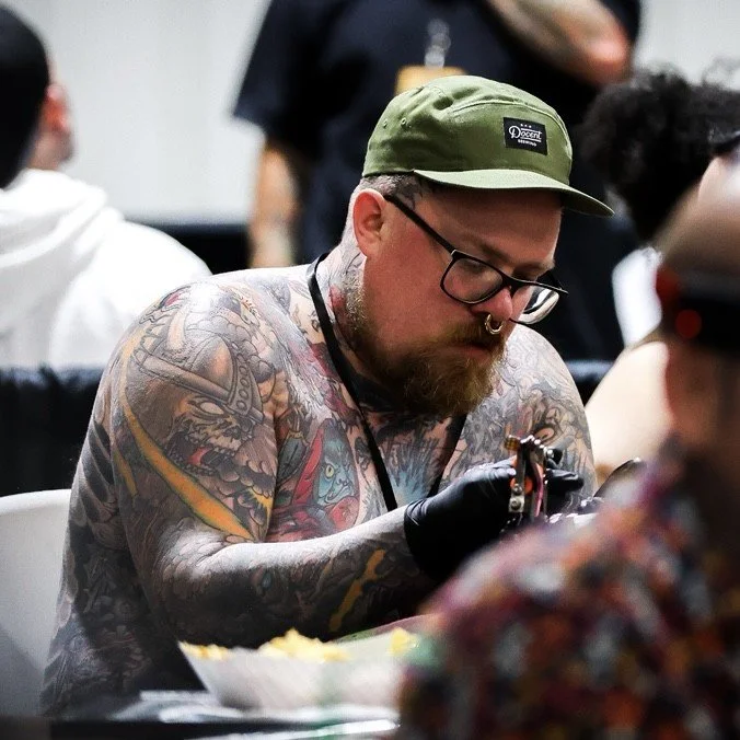 Thomas Christopher tattooing at Yeehaw Tattoo Expo 2025