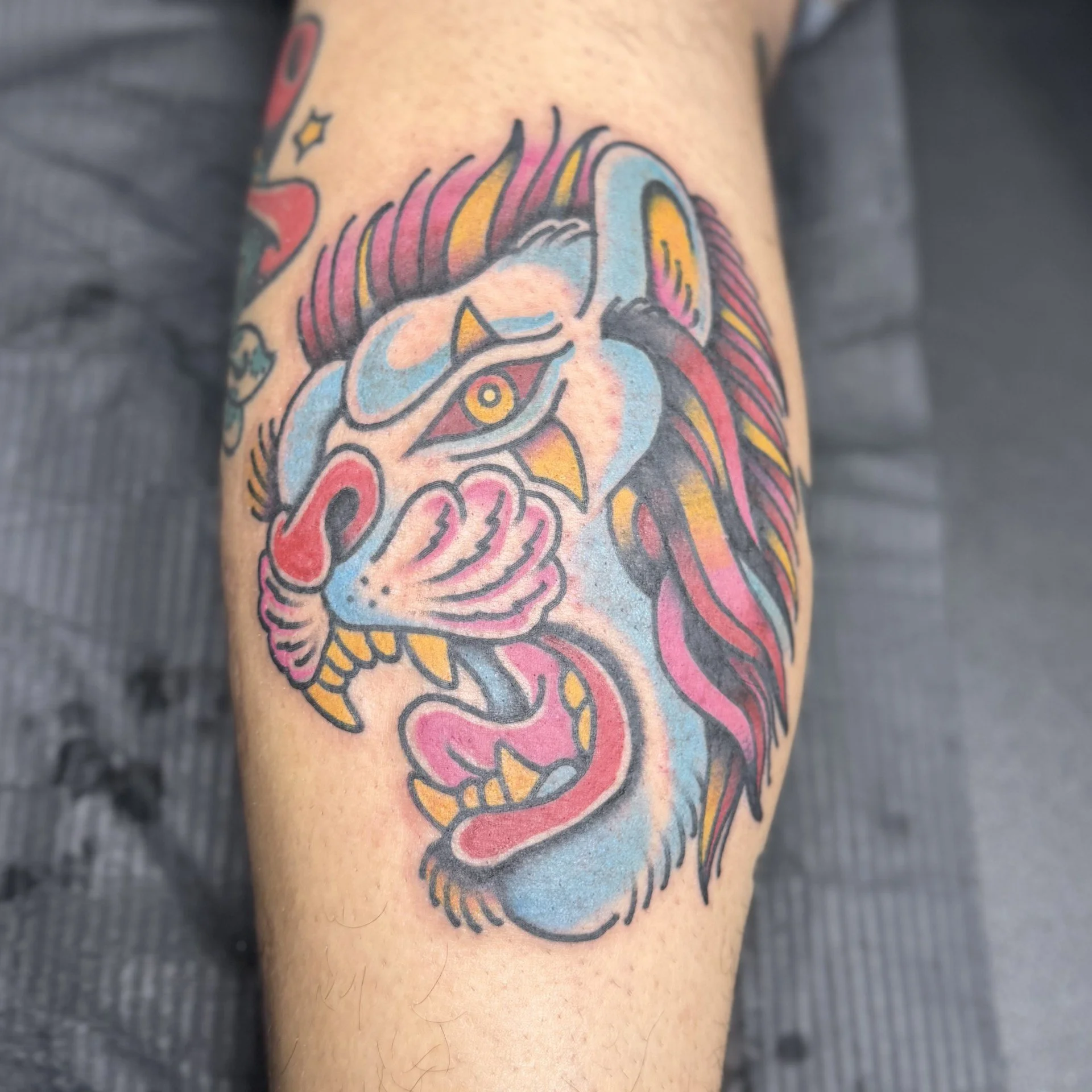 Full color tattoo of circus lion