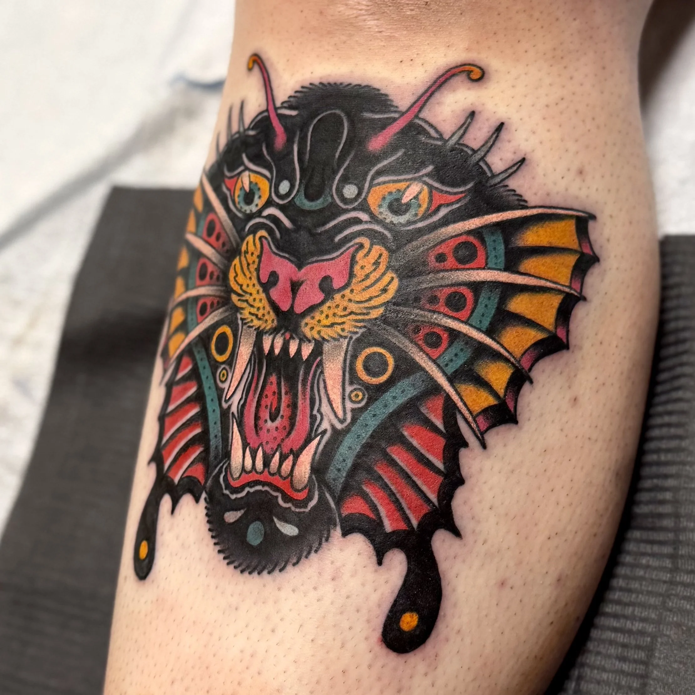 American Traditional panther butterfly shin tattoo