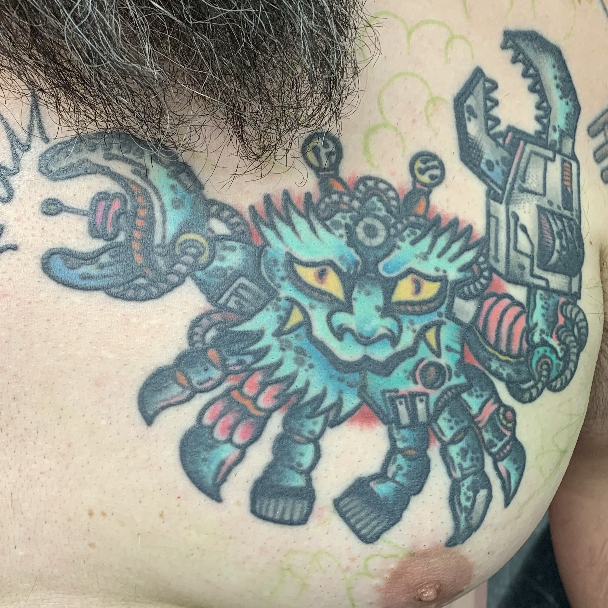 healed chest piece tattoo of a japanese traditional Heikegani Crab(or samurai crab) mashed up with some sci-fi shenanigans