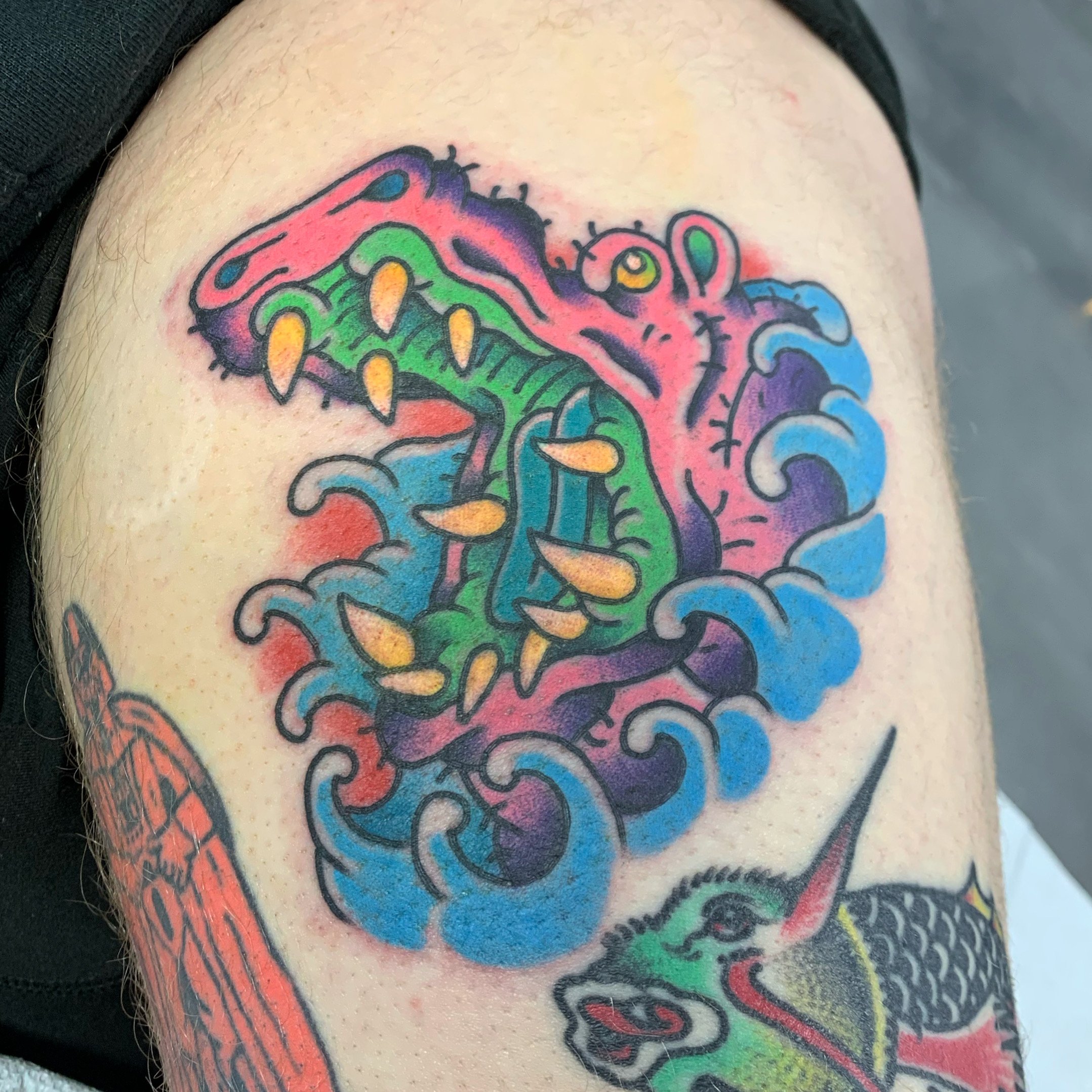Bright and bold pink attack hippo on a thigh