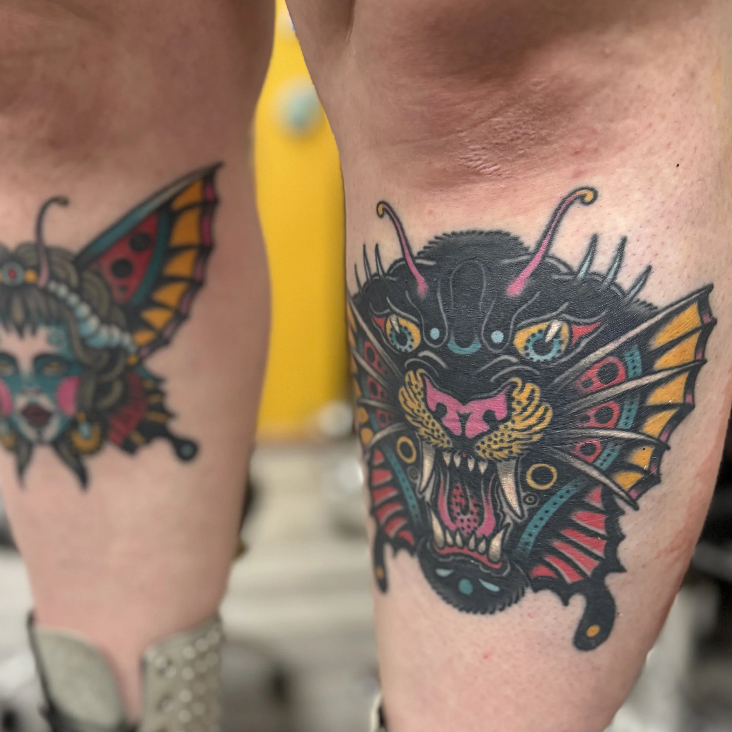 Pair of healed shin tattoos in a traditional style