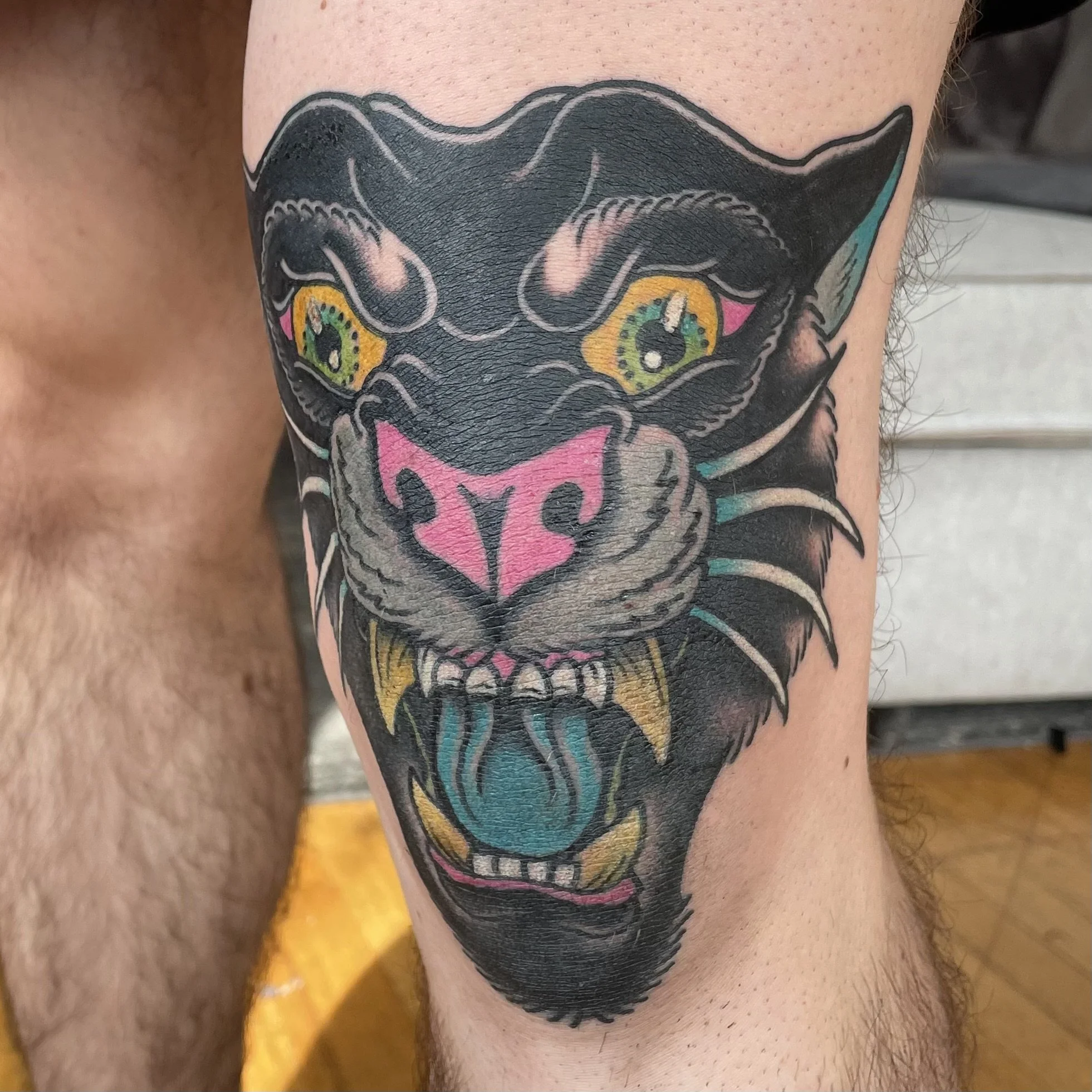 healed american traditional panther head on a knee cap