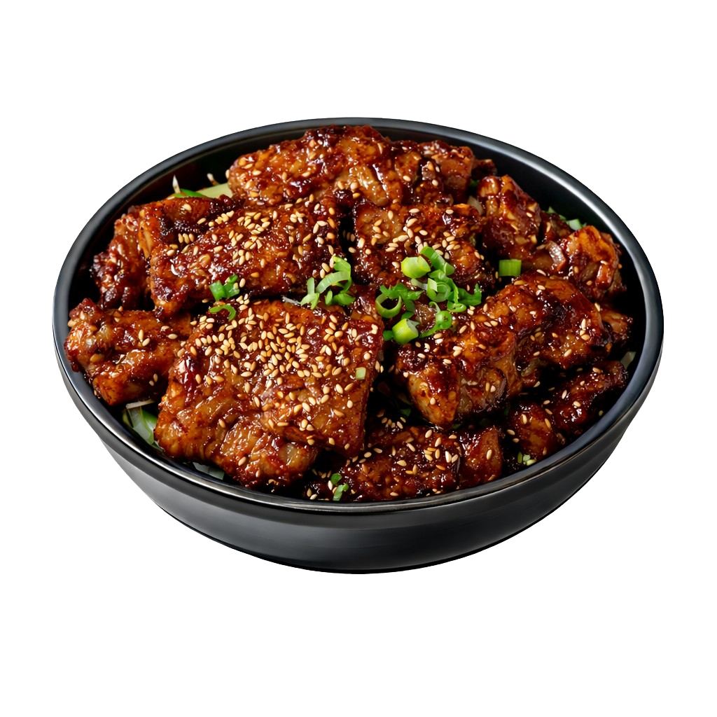 Bowl of glazed chicken pieces topped with sesame seeds and chopped green onions.