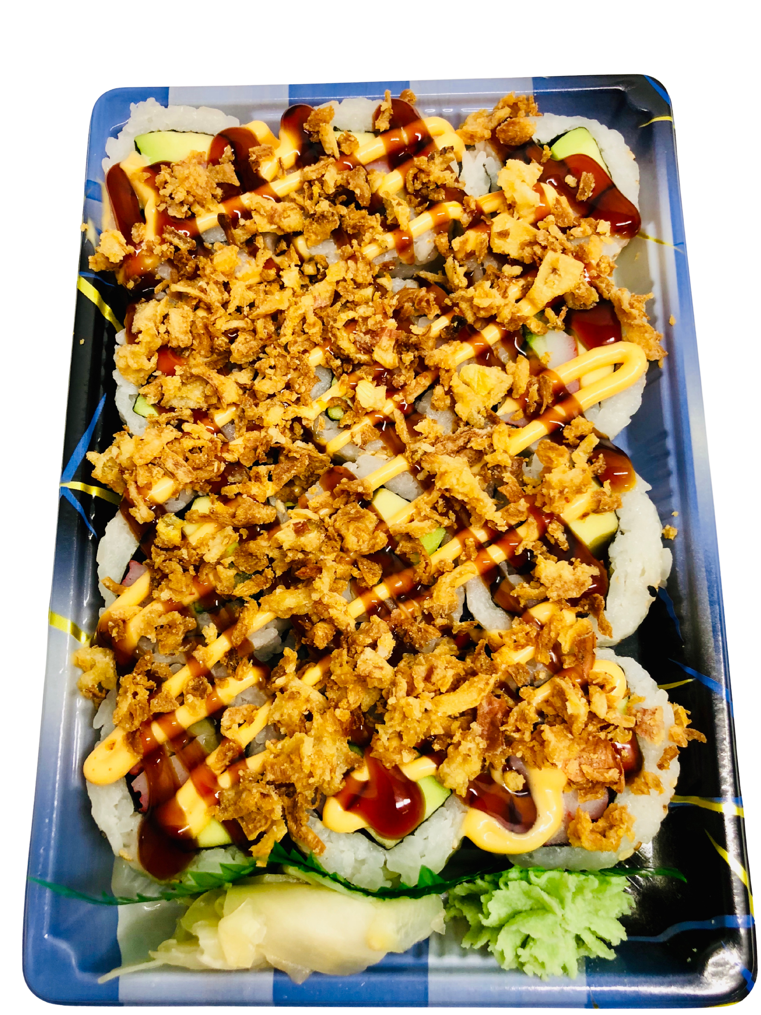 A tray of sushi rolls drizzled with sauces, topped with fried crispy bits, accompanied by shredded lettuce, ginger, and wasabi.