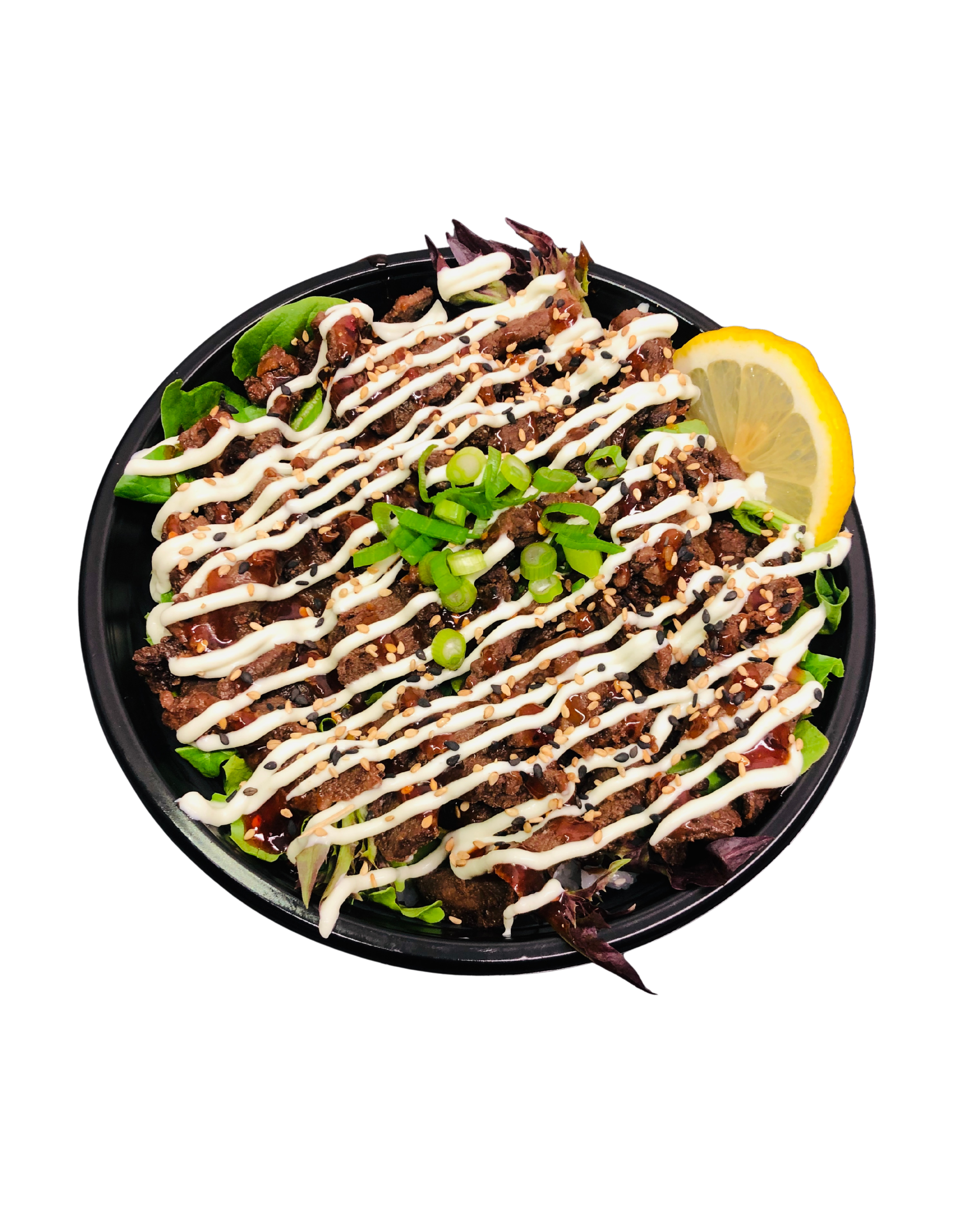 A takeout container filled with Asian beef salad, topped with mayonnaise, chopped green onions, sesame seeds, and a lemon wedge on the side.