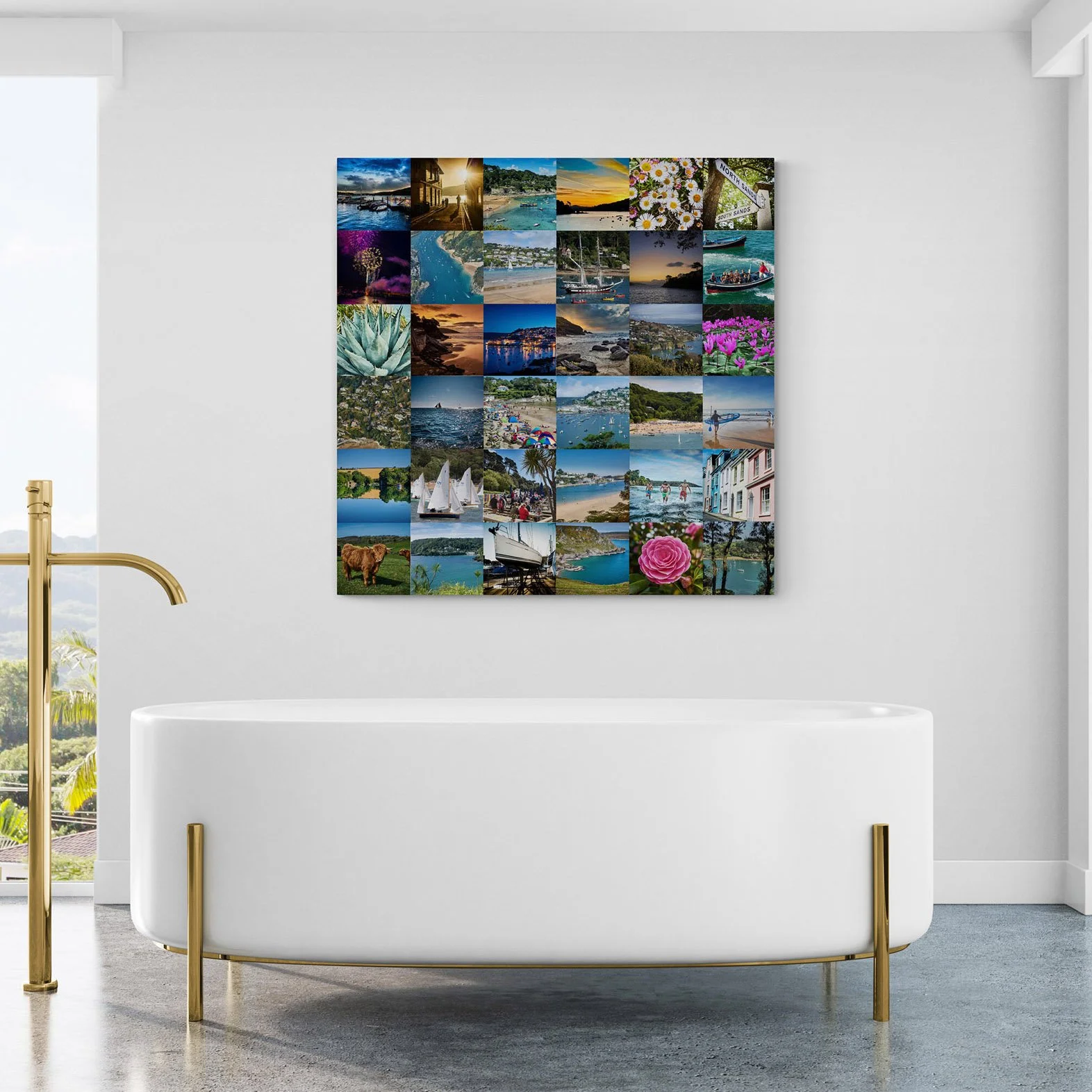 A wall collage of various travel and nature photographs. A white bathtub with gold legs is in the foreground, and a gold faucet is visible on the left side. There is a window with a view of greenery outside on the left.
