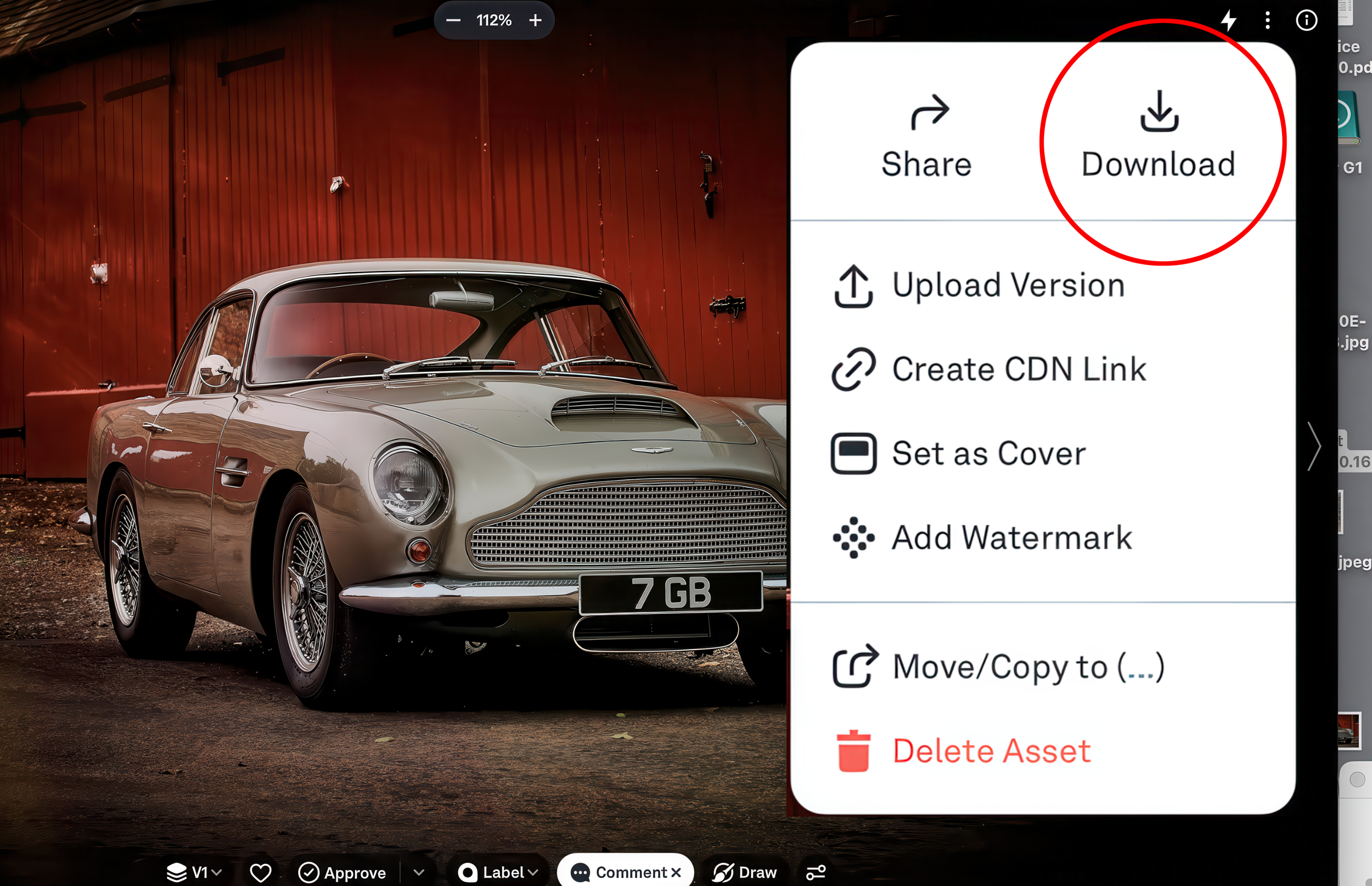 A vintage silver Aston Martin car parked in front of a red wooden wall with a pop-up menu showing options including Download and Delete Asset.