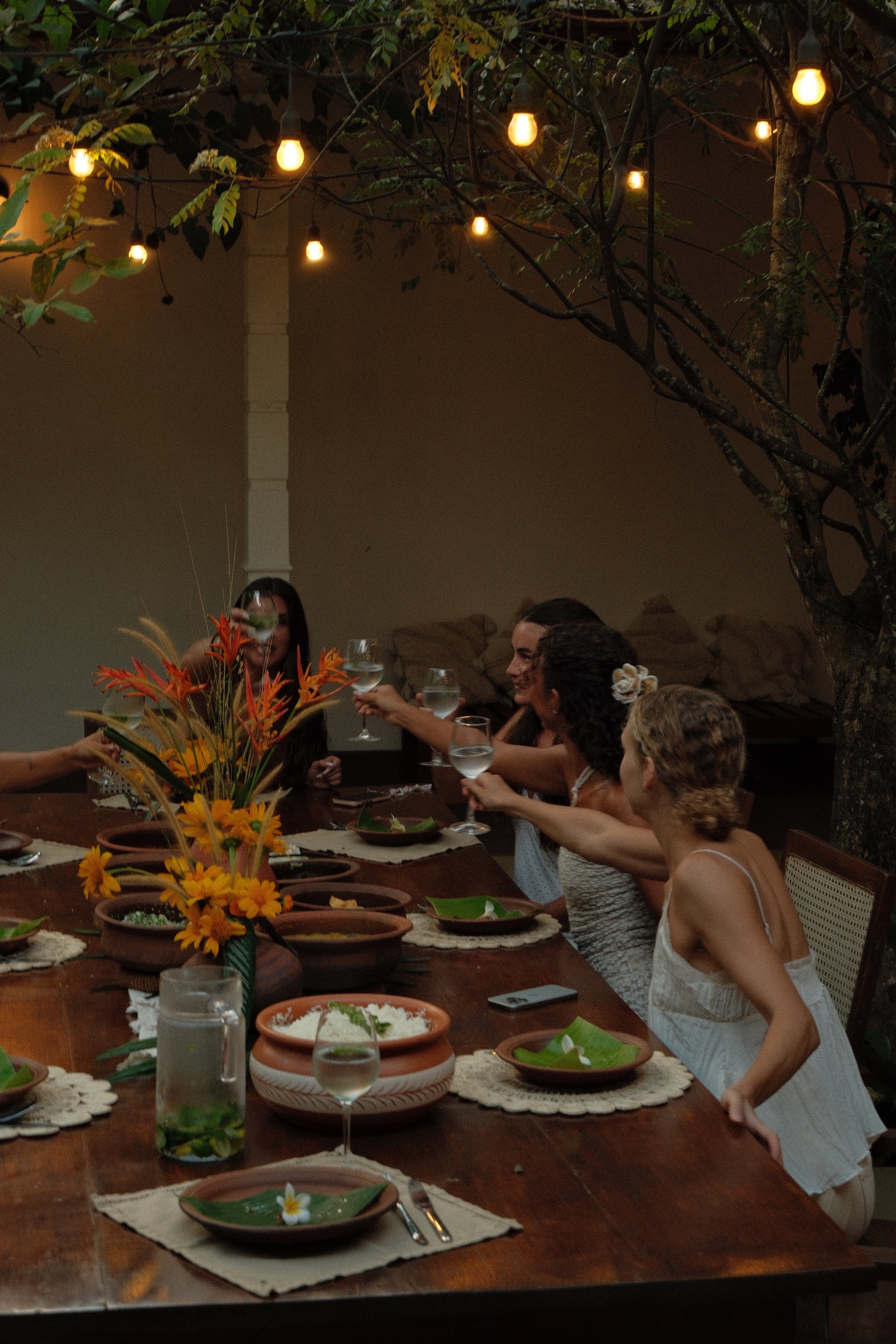 Guests gathering for dinner at the villa