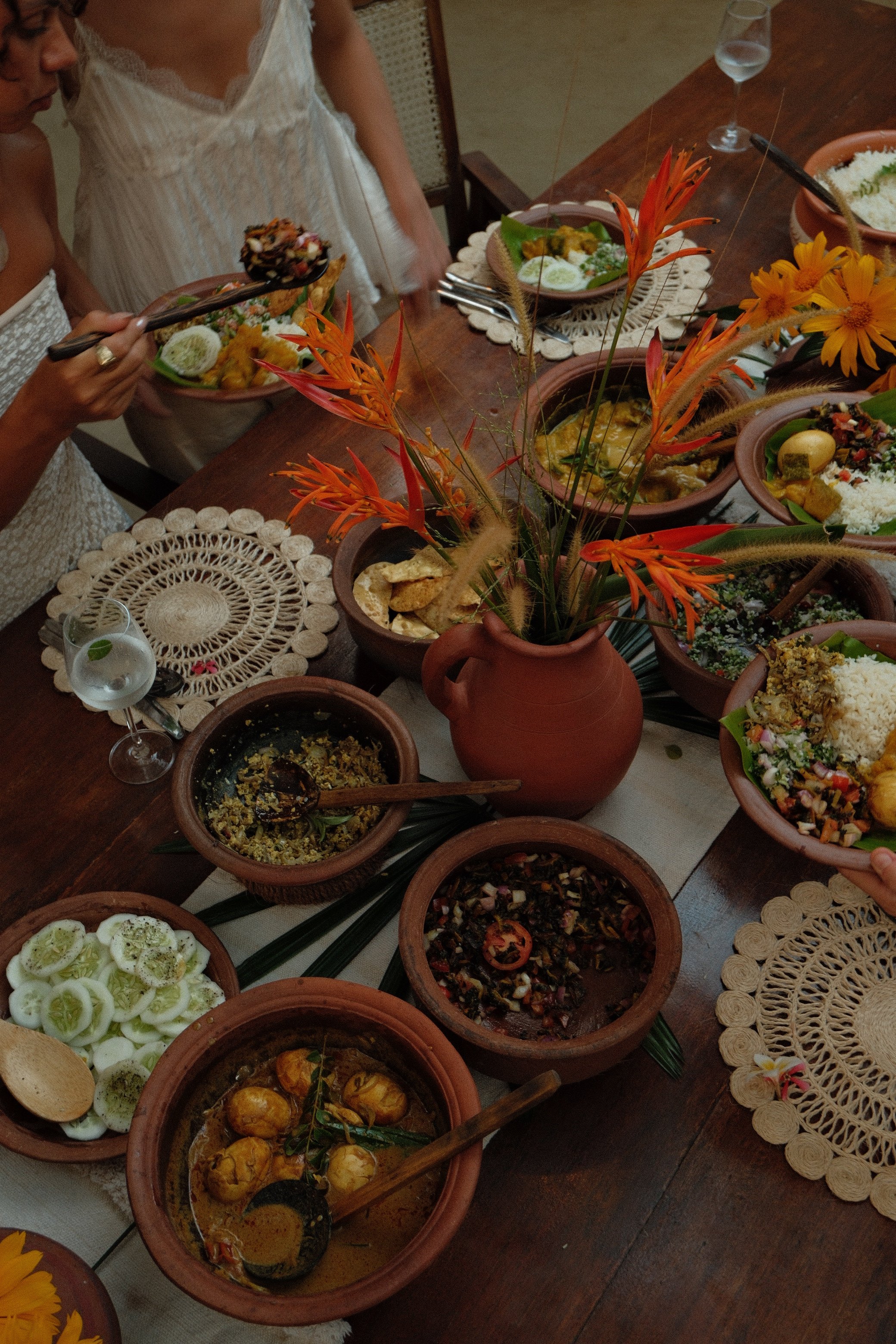 Long table dinners and shared evenings at a women’s wellness retreat in Sri Lanka.