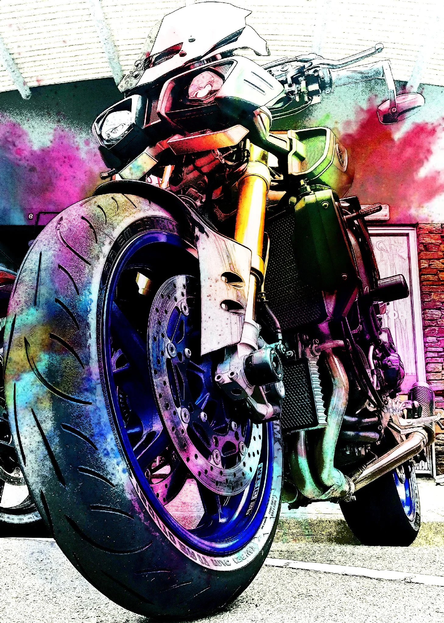 Side view of a sport motorcycle parked on the ground, with a focus on the front wheel and braking system, including the disc brake and caliper. The motorcycle has a sleek design with a black and yellow color scheme.