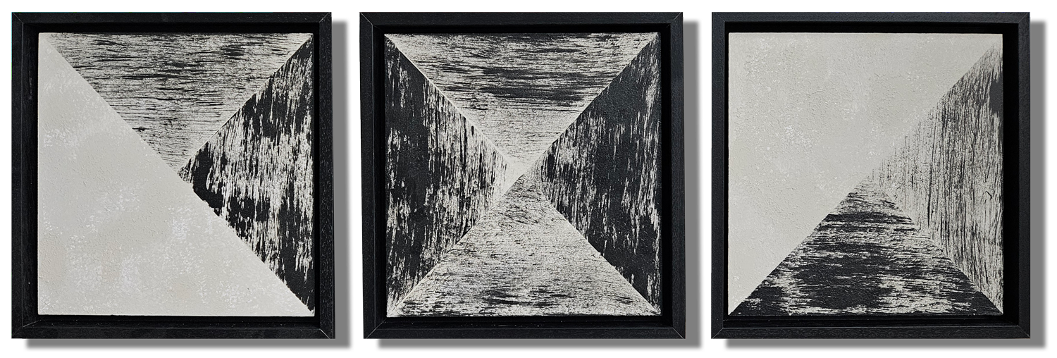 Three abstract square art pieces featuring geometric triangles and textured black and white patterns, framed in black.