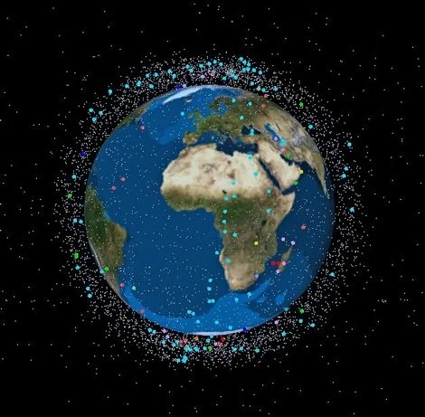 Earth with surrounding satellite debris in space.