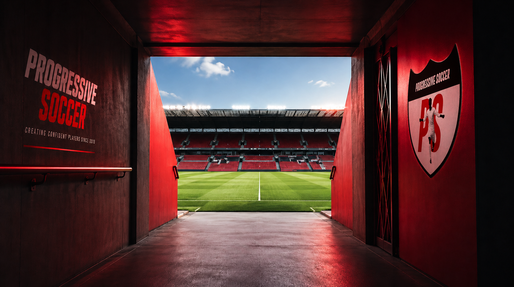 View of a football stadium from the tunnel, showing a green field, red seating, and a bright sky.