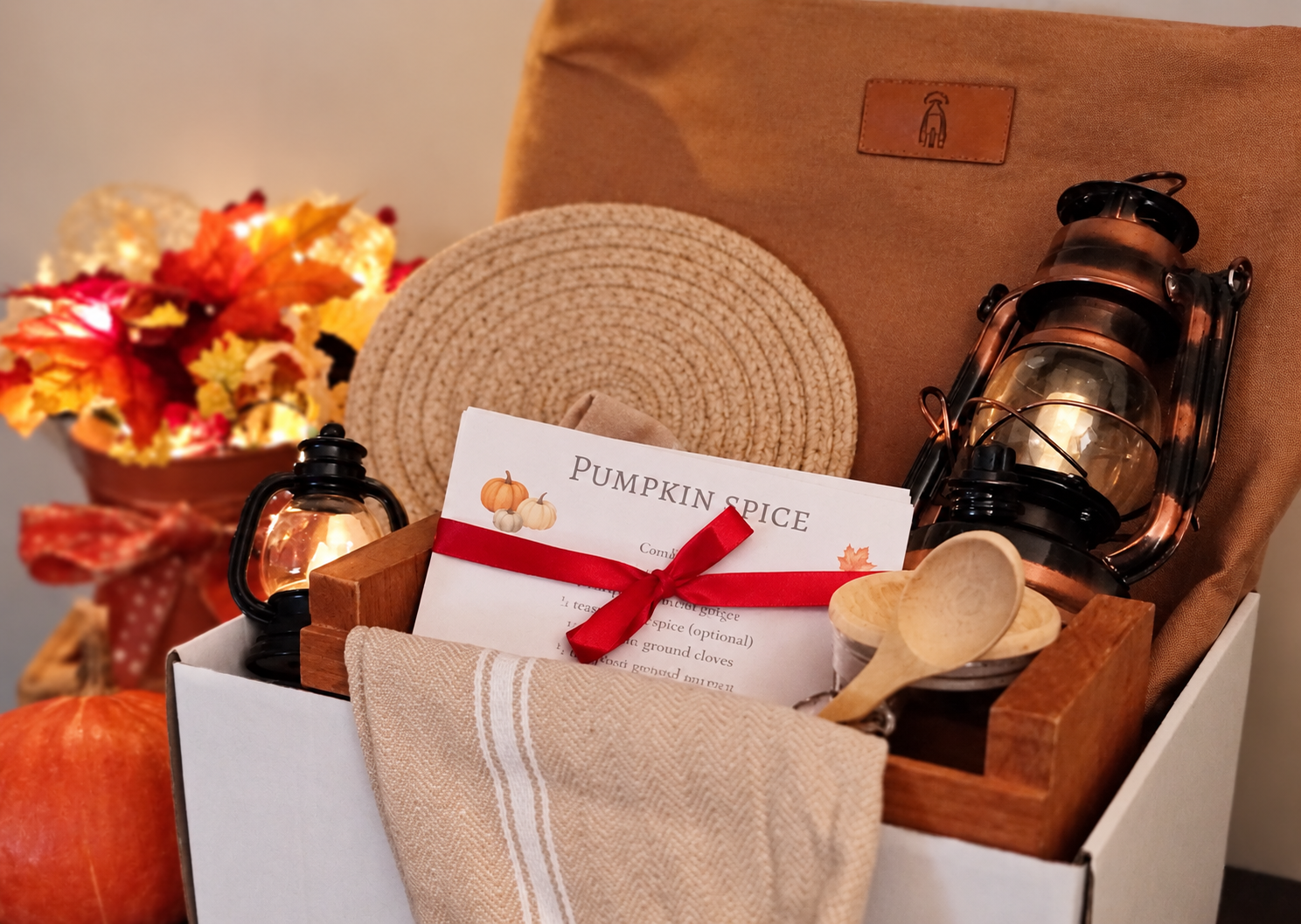Autumn Afternoon Collection packed in gift box with wooden crate, recipe cards, kitchen towel, spice jar, lanterns, trivet and nutmeg canvas tote.