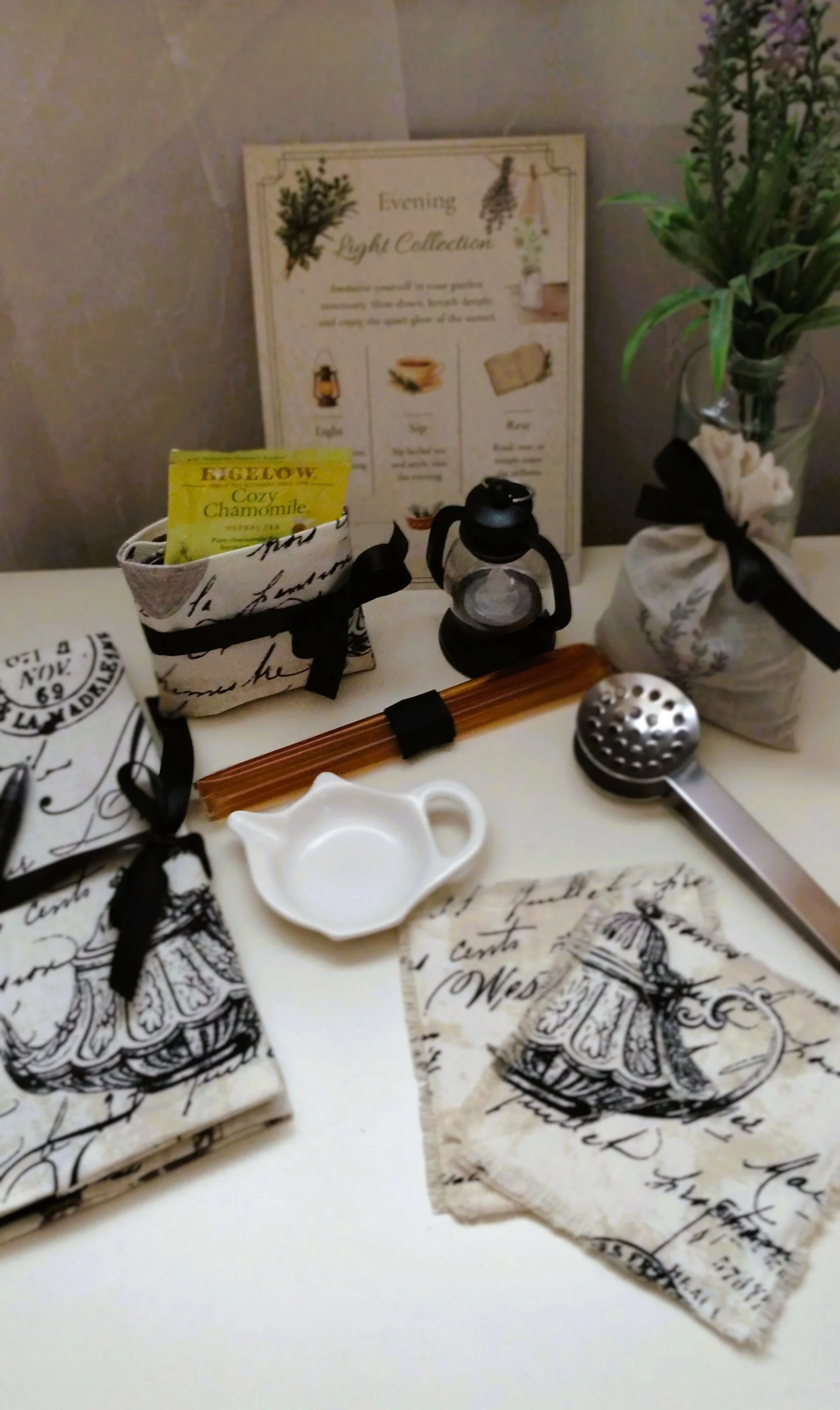 Evening Light gift set with journal, tea and honey, lavender sachet, tea accessories, frayed coasters and mini lantern.