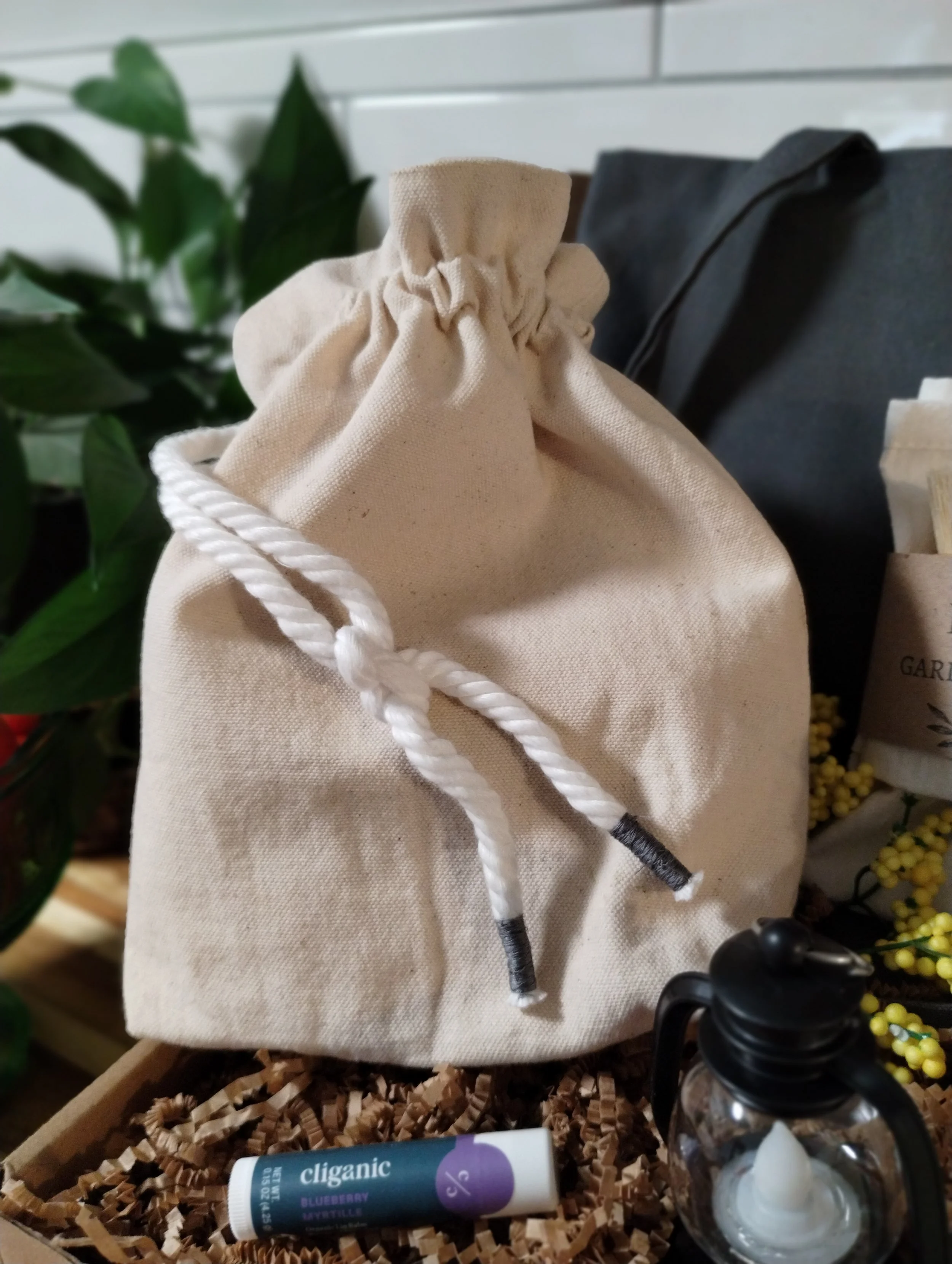 Handmade natural canvas gathering pouch with white rope drawstrings included in the Market Collection.