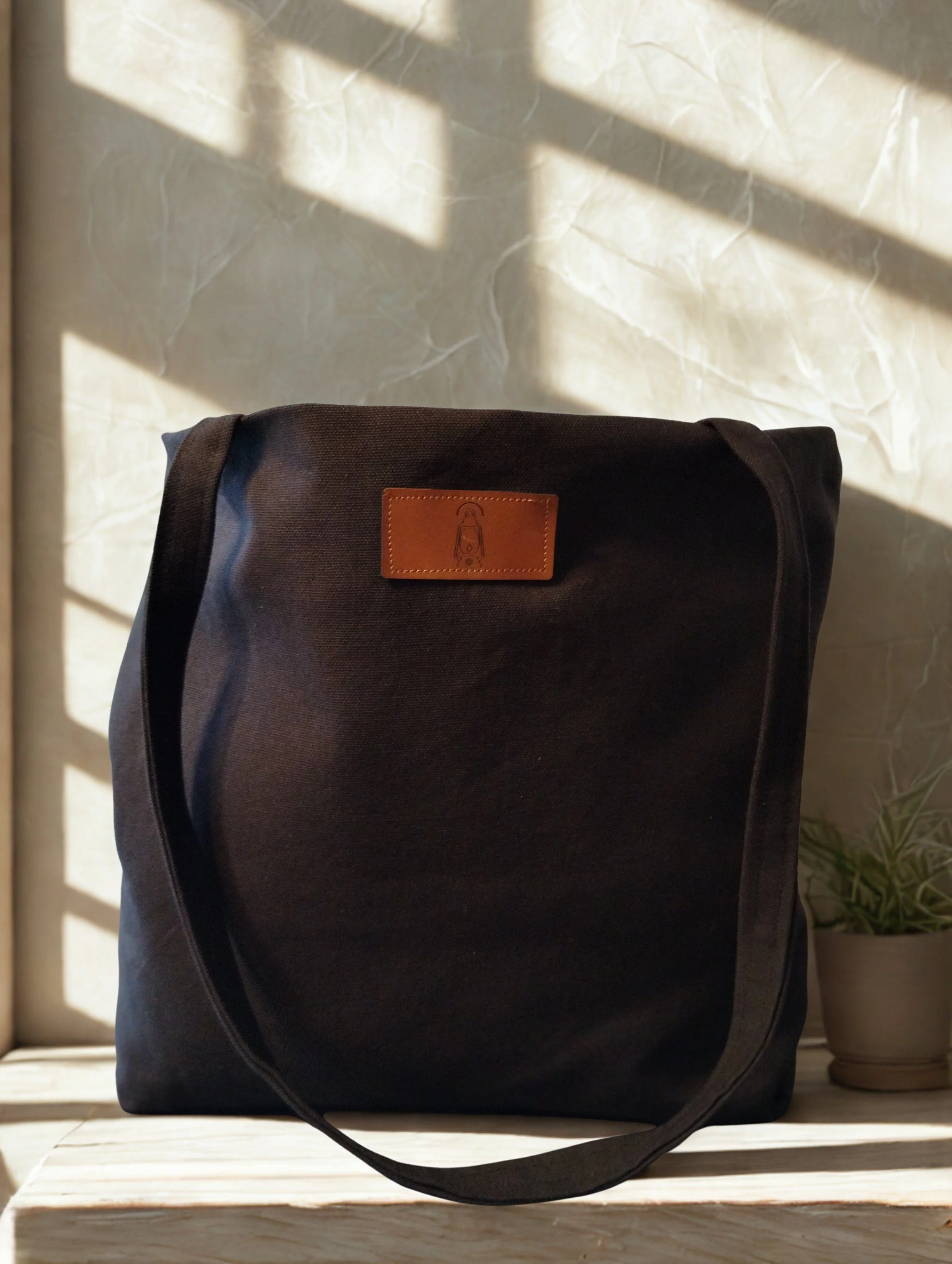 Charcoal handmade duck canvas tote bag with leather lantern label and long shoulder straps