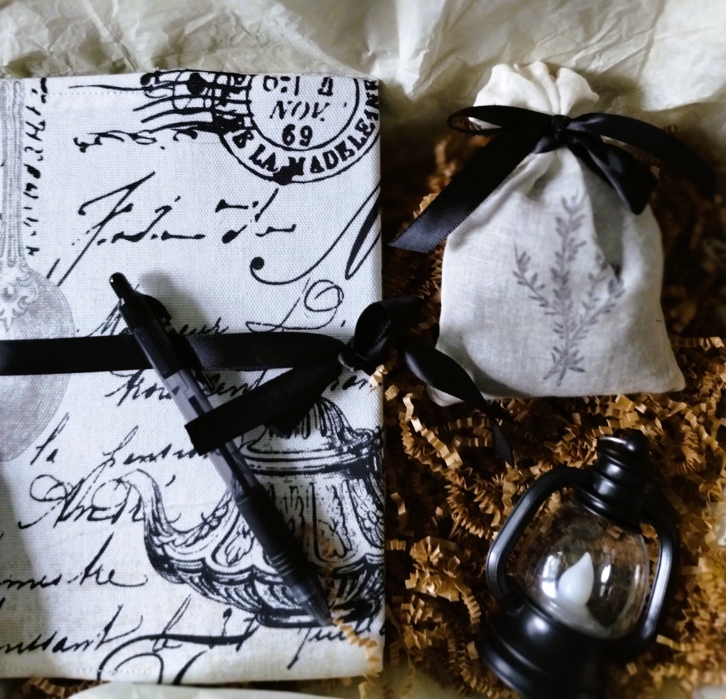 Quiet Moments gift set packaged with fabric-covered journal and pen, lavender sachet, and mini lantern.