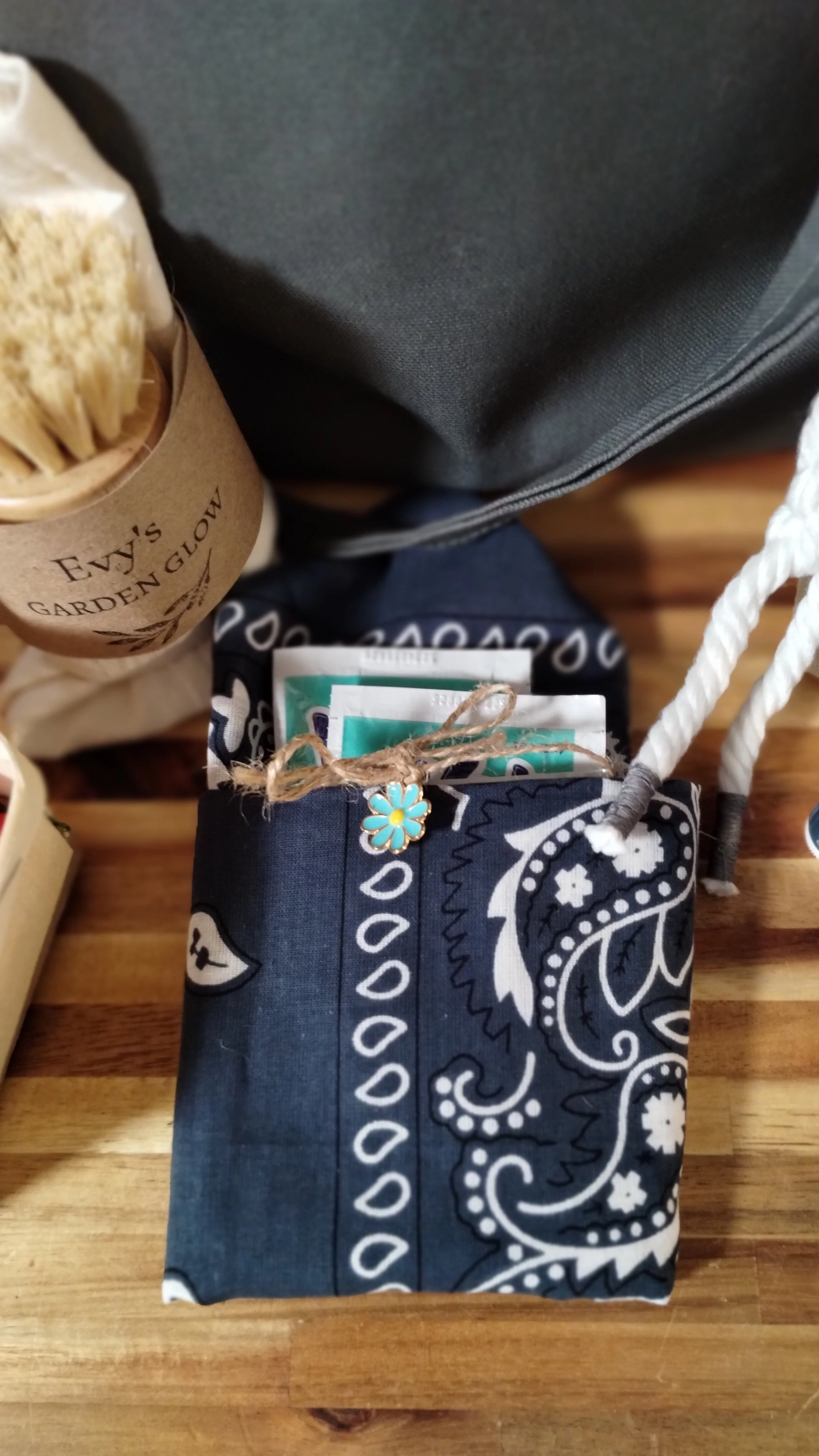 Handmade navy bandana personal bundle with pocket, wipes and small turquoise flower charm.