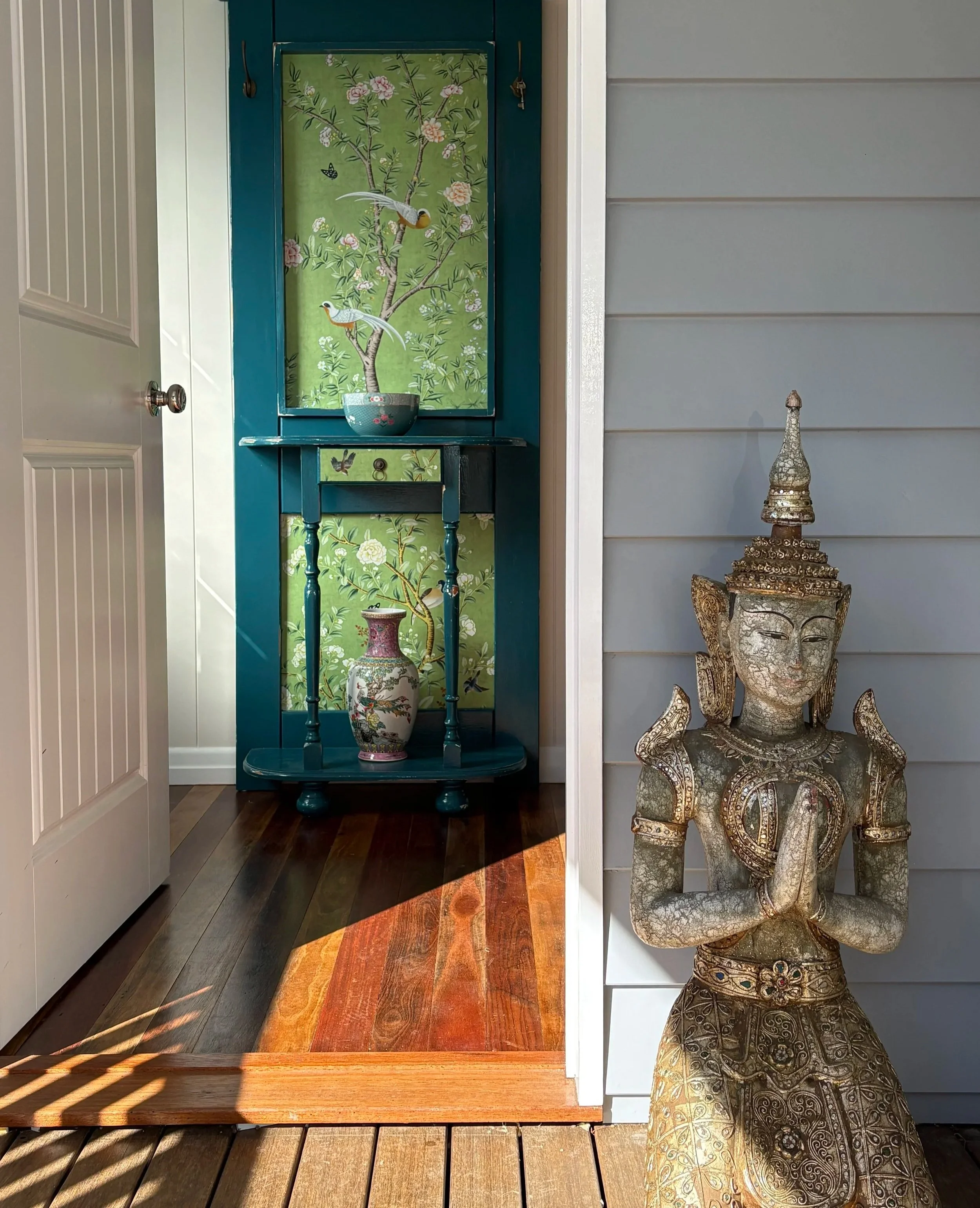 A serene buddha statue welcomes you into our safe, cosy healing space at the Kindred Soul House of Healing in Maleny, Queensland.