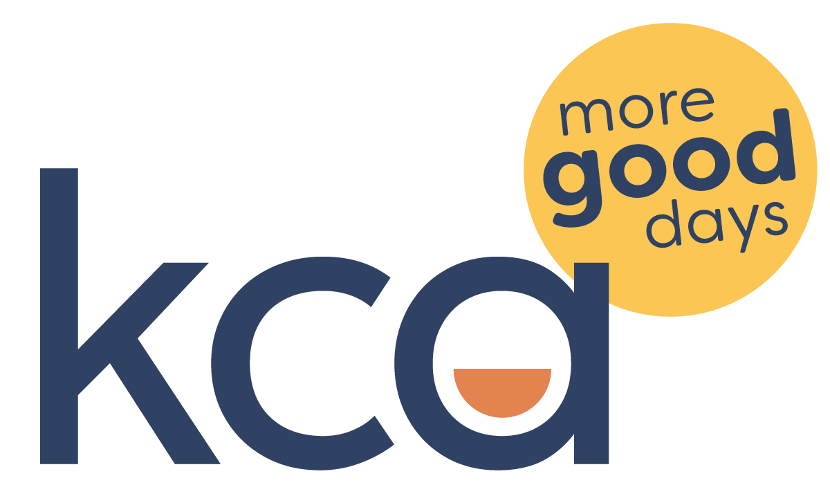 KCD logo with a yellow circle containing the words 'more good days' and a stylized coffee cup replacing the letter 'a' in 'kcd'.