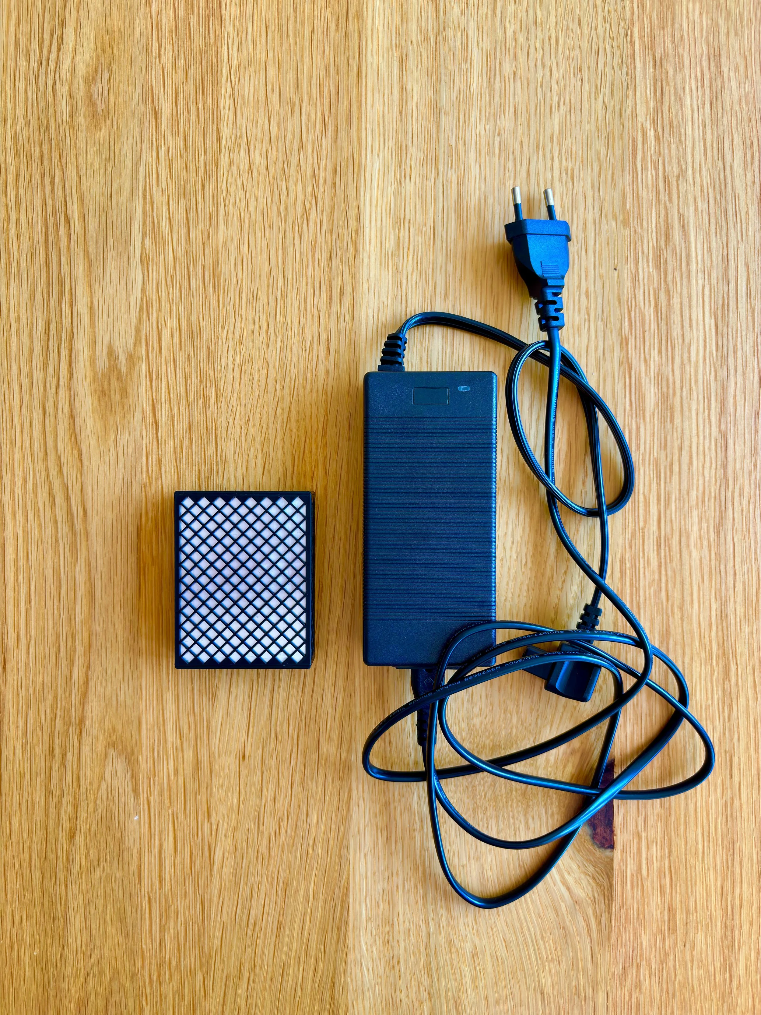 TravelWatt size comparison to a generic charger
