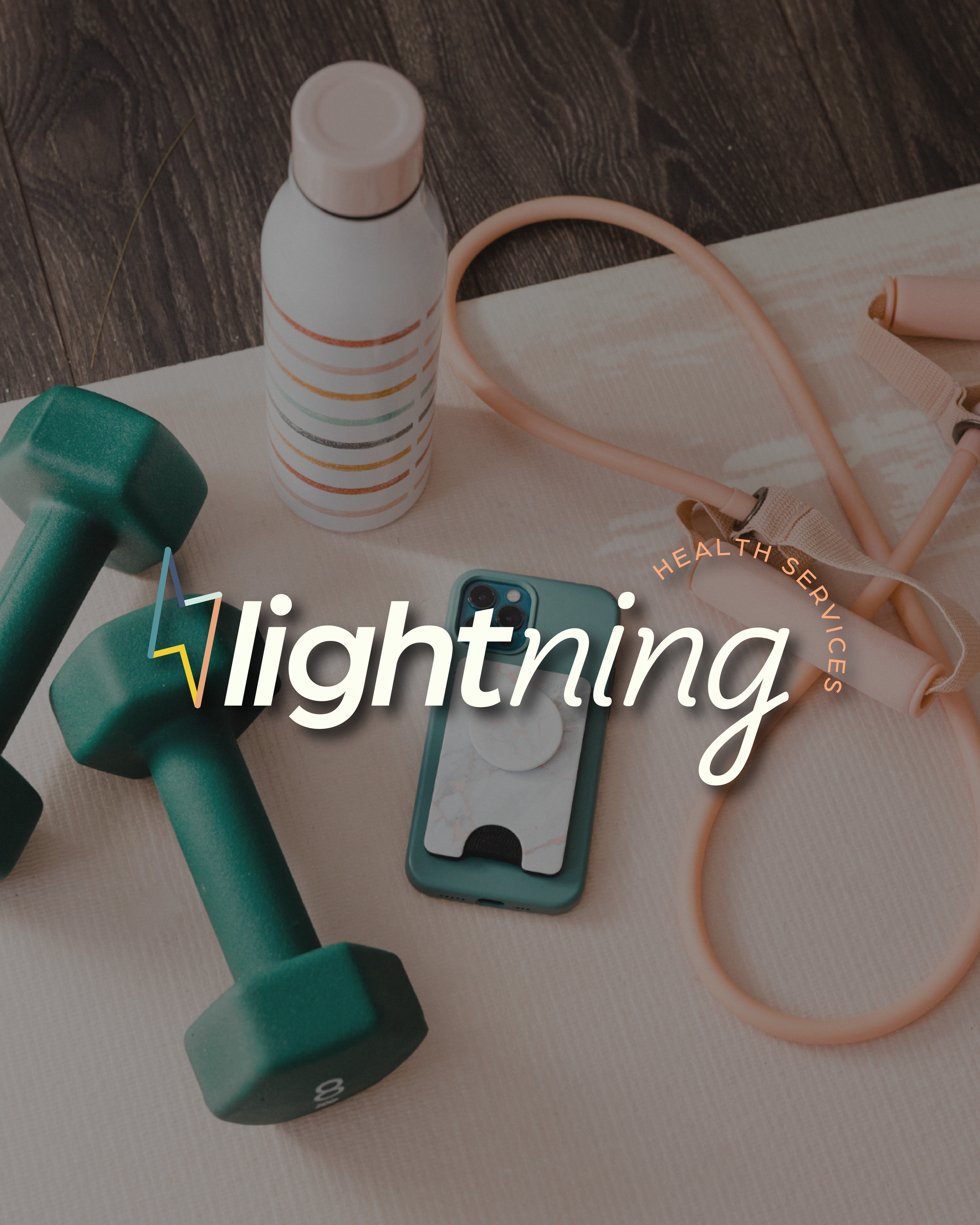 Close-up of a green dumbbell, a water bottle, a pink resistance band, and an iPhone on a beige yoga mat on a wooden floor, with a partial view of the word 'lightning' and a circle with 'health services' written around it.
