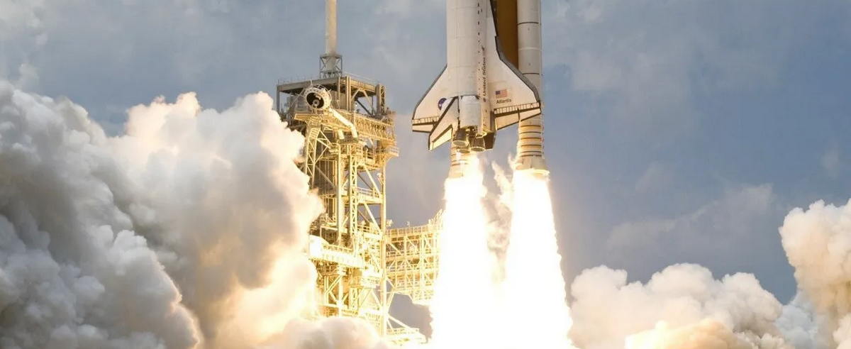 A space shuttle launching into the sky with flames and smoke.
