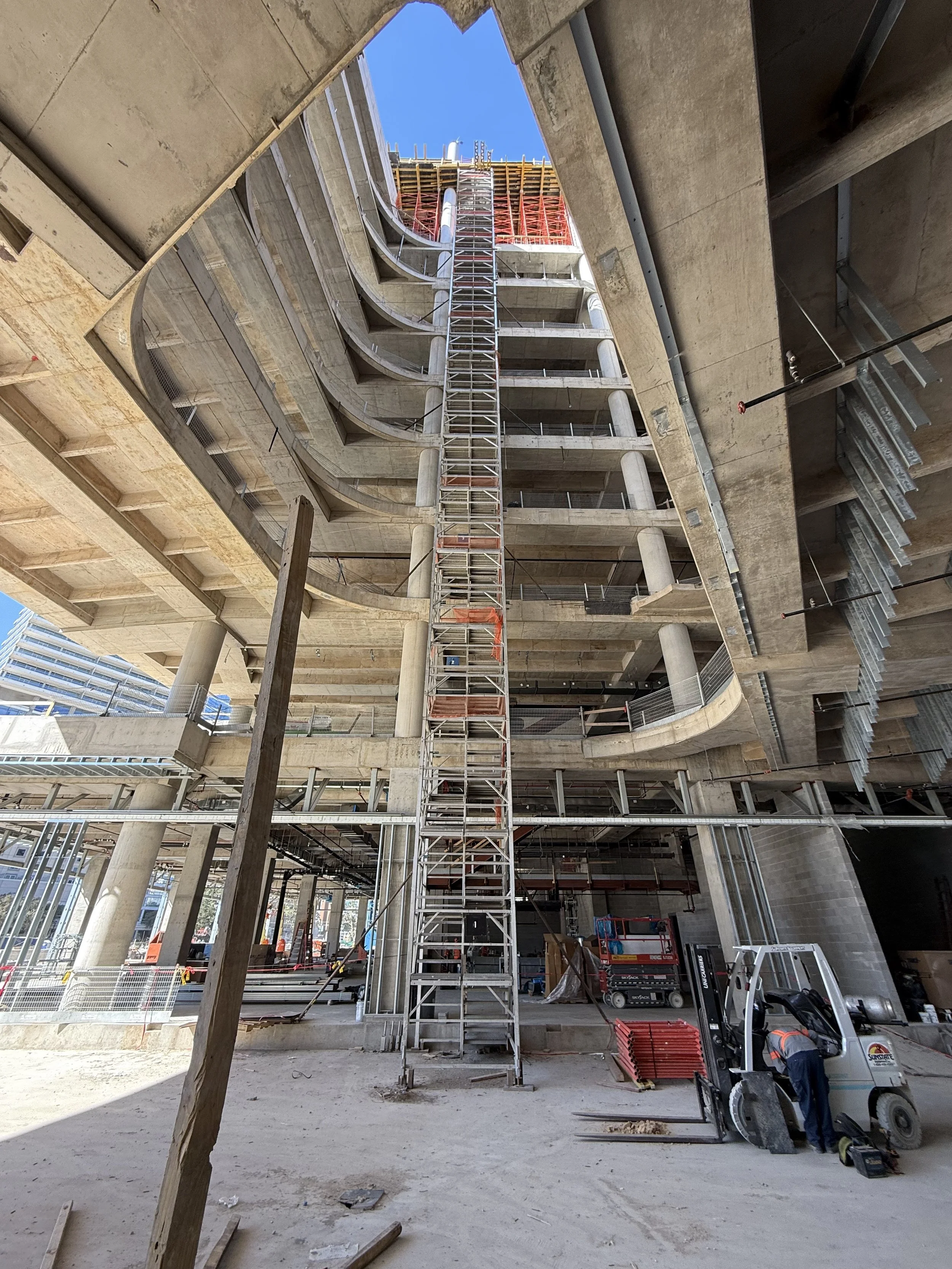 Z-Stack temporary construction stair system installed inside a multistory commercial building, providing modular vertical access during active construction.