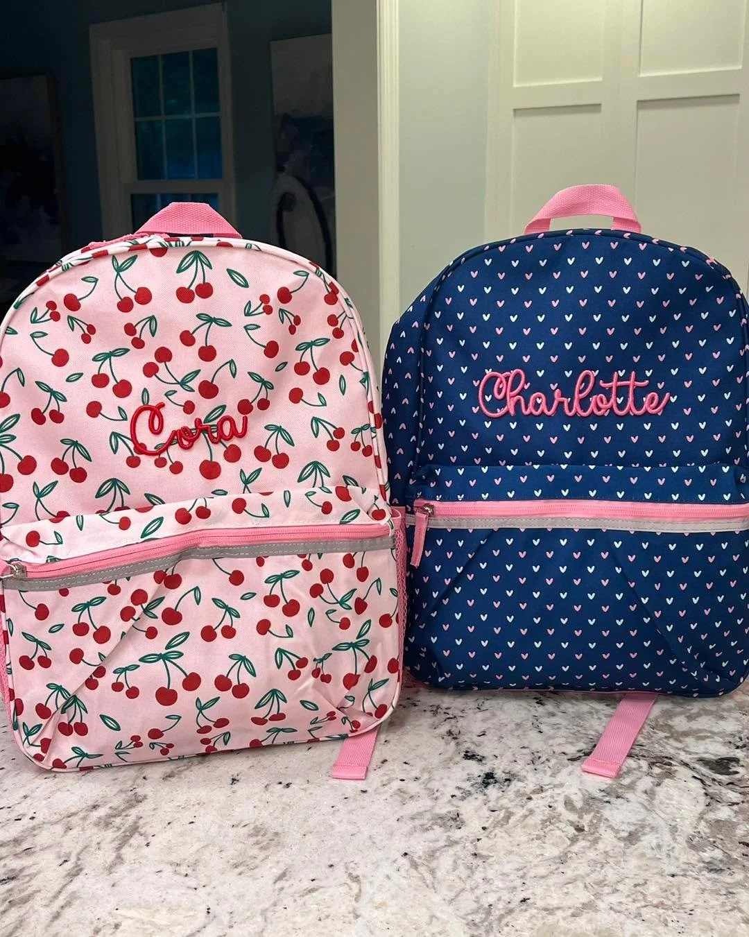 First day of school is closing in fast! 🎒
These two turned out so sweet &mdash; a cherry print and a navy heart print, each with a name stitched in raised 3D puff. That puff texture is the detail parents always end up loving, and it makes finding yo