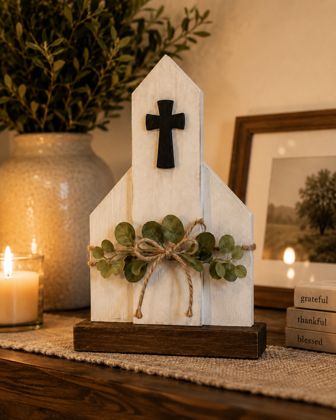 Handcrafted wooden church with cross, silk greenery, and a jute bow by The Memory Barn.