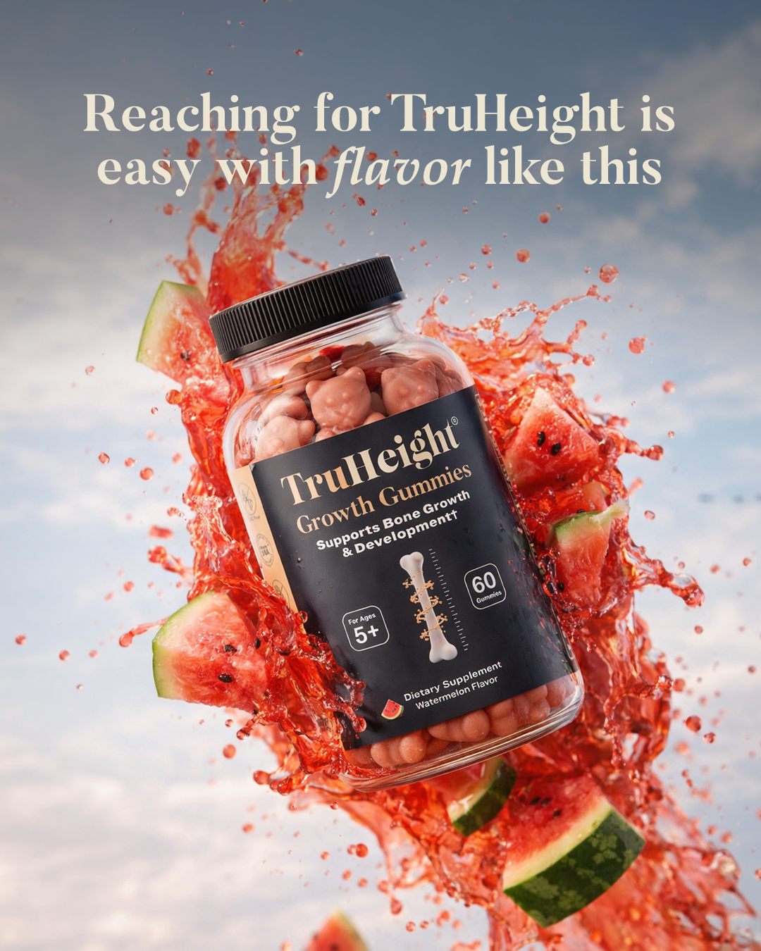 Bottle of TruHeight Growth Gummies surrounded by watermelon slices with splashing juice against a sky background.