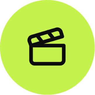 Icon of a movie clapperboard within a green circle.