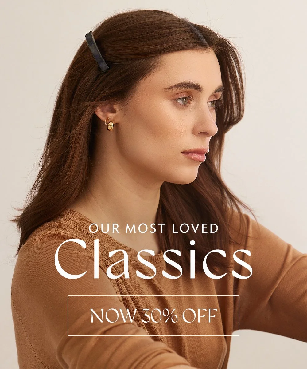 Woman with brown hair and gold earrings looking to the side, wearing a beige top, with text overlay promoting classic fashion items with a 30% discount.