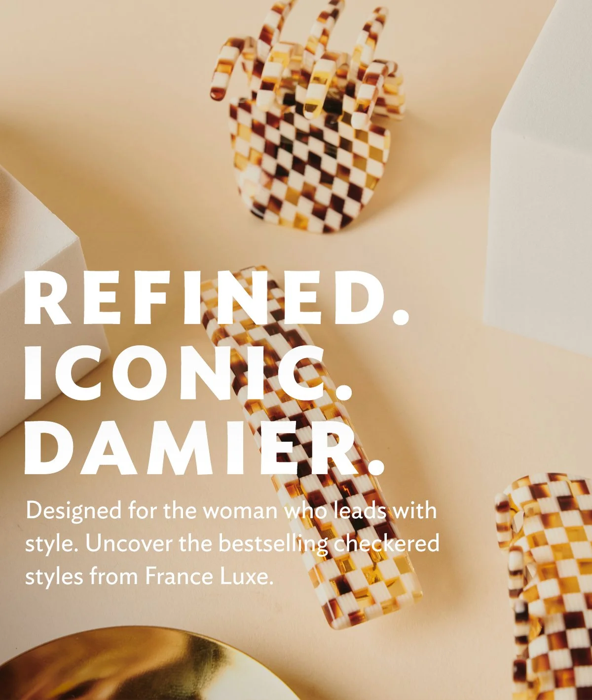 Close-up of a checked leopard print bracelet and matching earrings, with white and gold geometric objects in the background. Overlaid text reads: "Refined. Iconic. Dapper. Designed for the woman who leads with style. Uncover the bestselling checkered