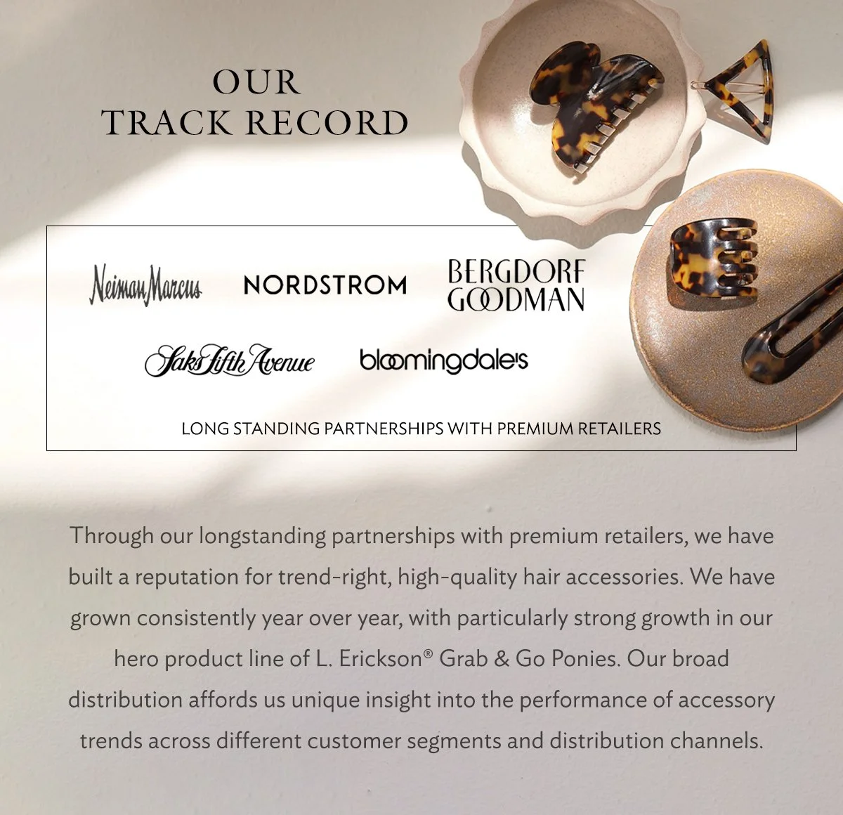 Printed advertisement for hair accessories with logos of high-end retailers, jewelry pieces in tortoiseshell patterns on plates, and a strip of text describing partnerships with premium retailers and product growth.