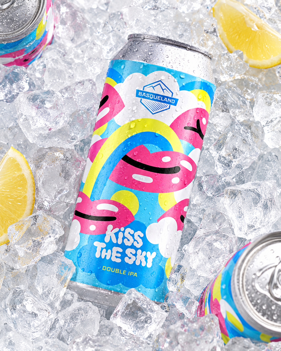A colorful can of Basqueland beer labeled 'Kiss The Sky Double IPA' resting on ice with lemon wedges nearby.