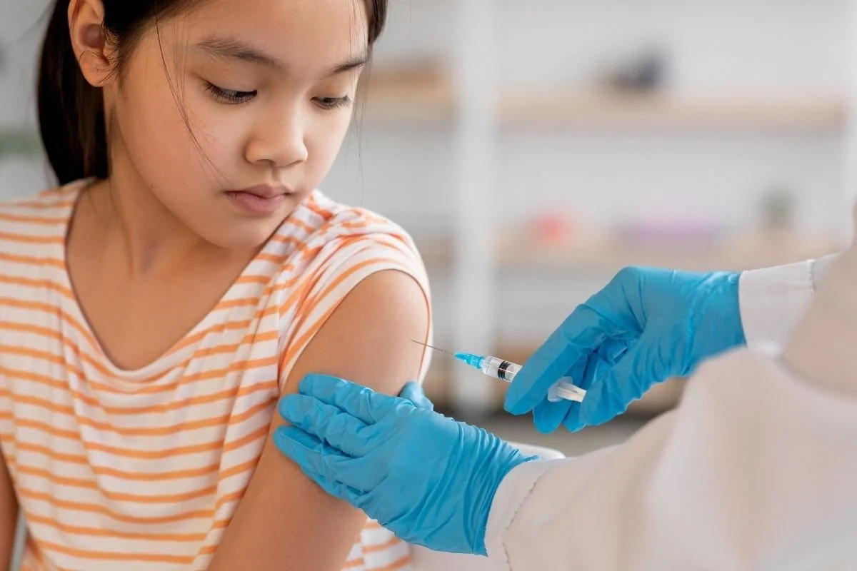 Child receiving immunizations at IndyCare Health in Kannapolis.